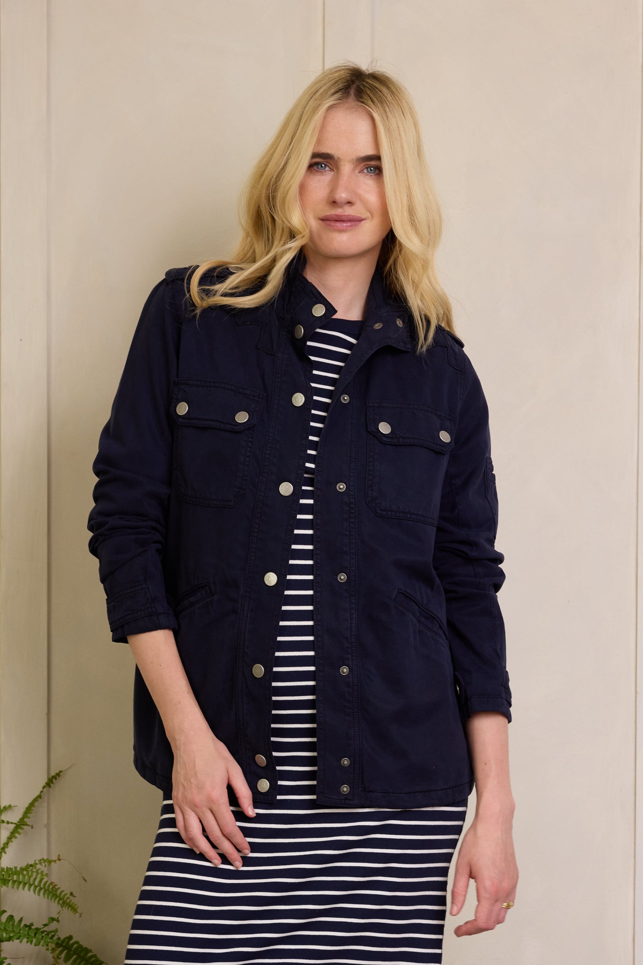 What to wear to the airport, a Tina Shacket in navy layered for a comfortable but polished travel outfit