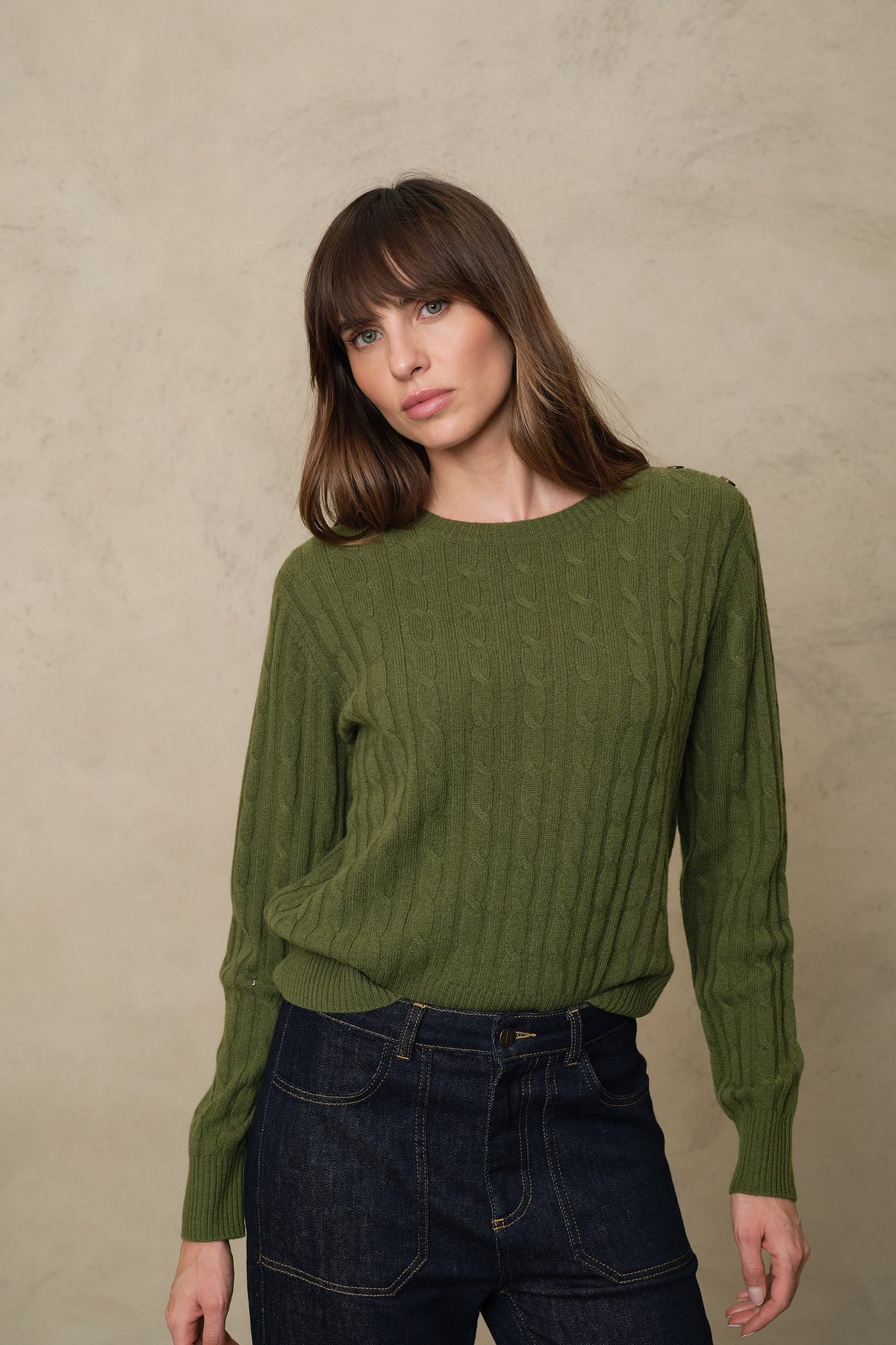 Green cable knit jumper, the Cory in light olive with contrast shoulder buttons