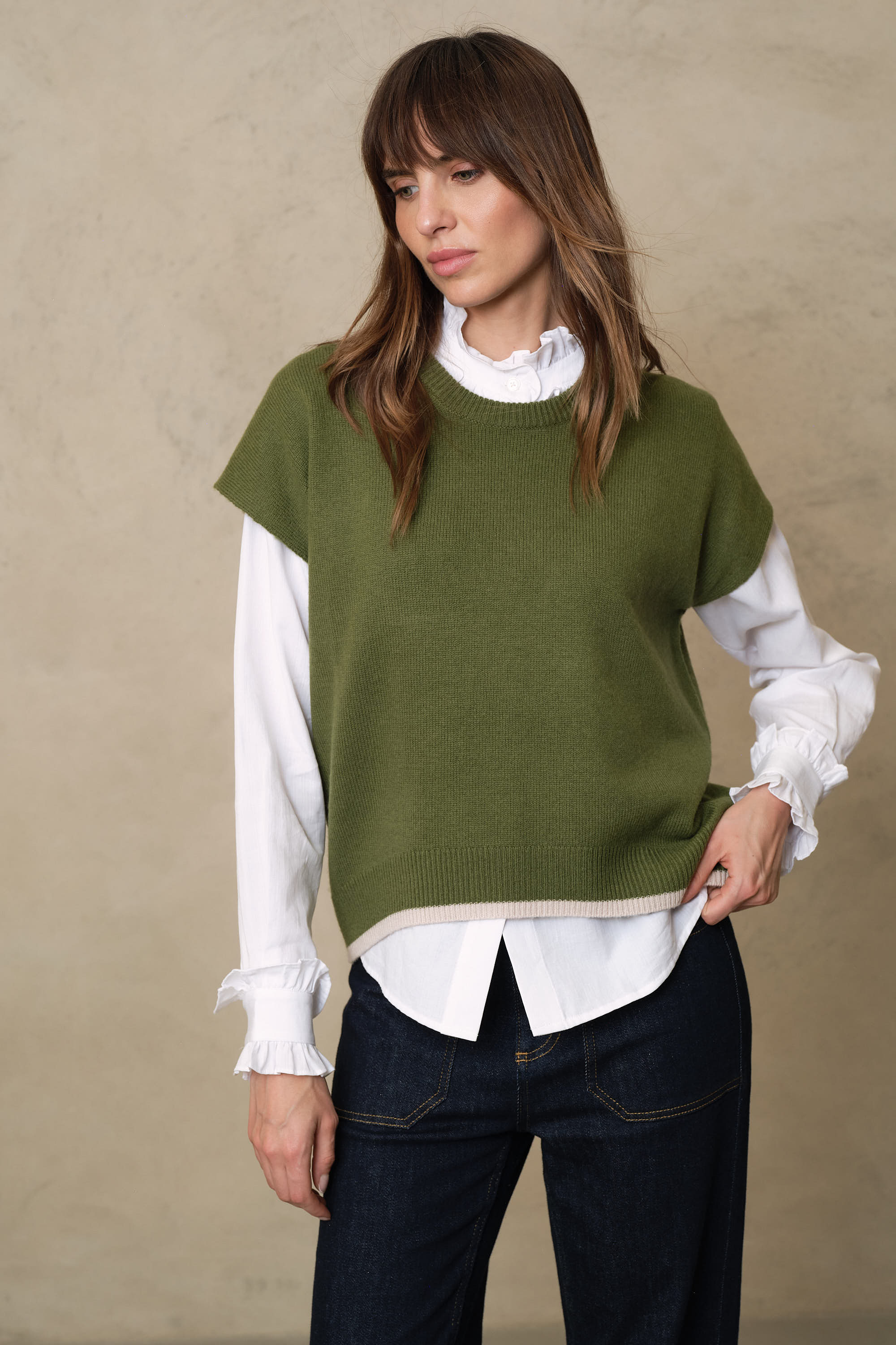 Ora light olive knitted vest with a taupe contrast trim at the hem and neck