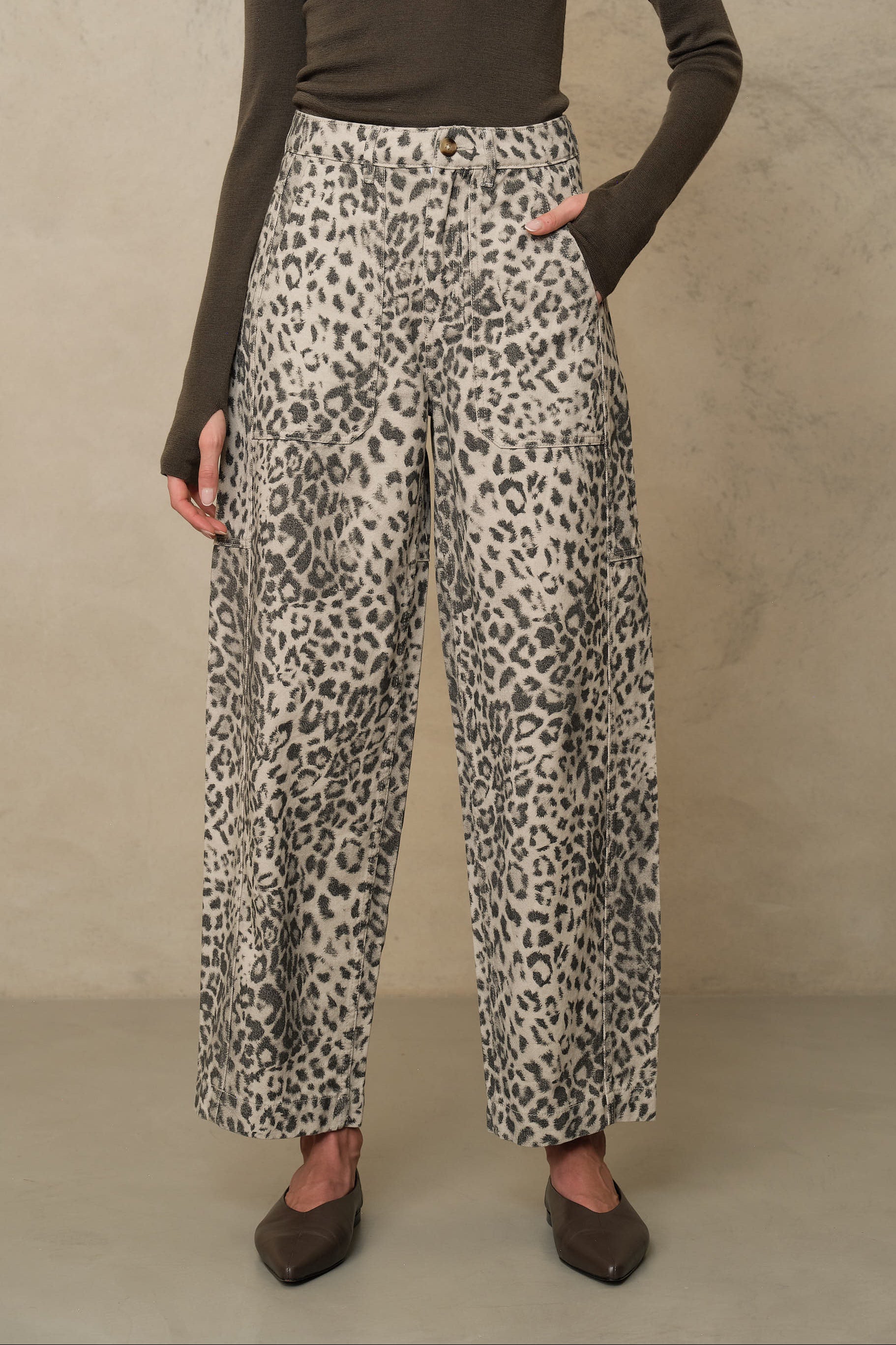 Billie leopard print barrel leg trousers worn with an olive roll neck and black flats