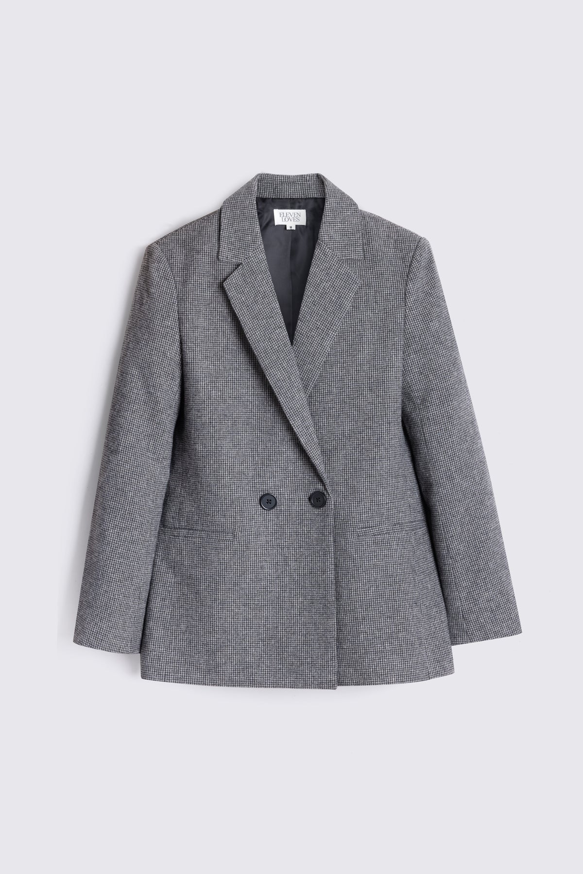 Teyha double breasted houndstooth tweed blazer on a plain background