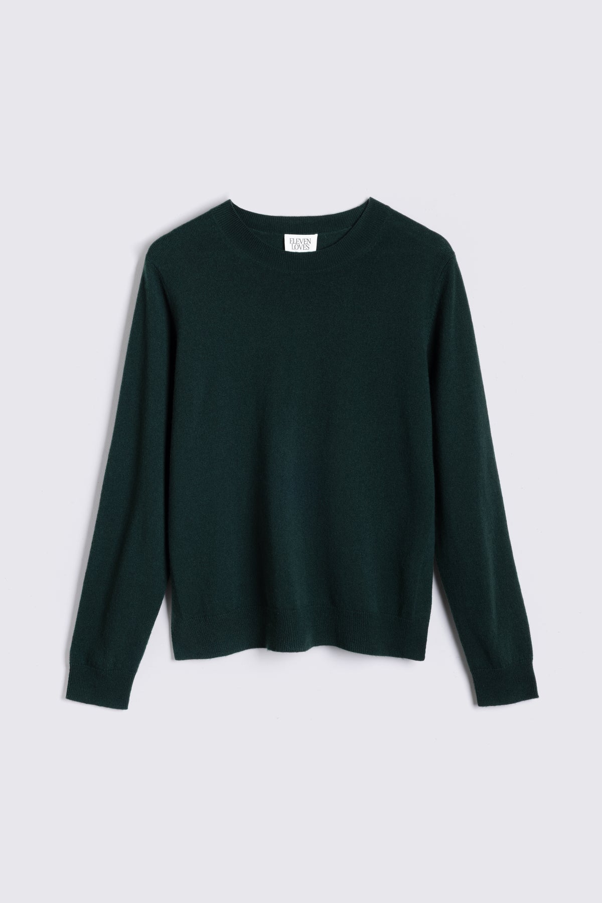 Alex cashmere blend jumper in bottle green laid flat on a plain background