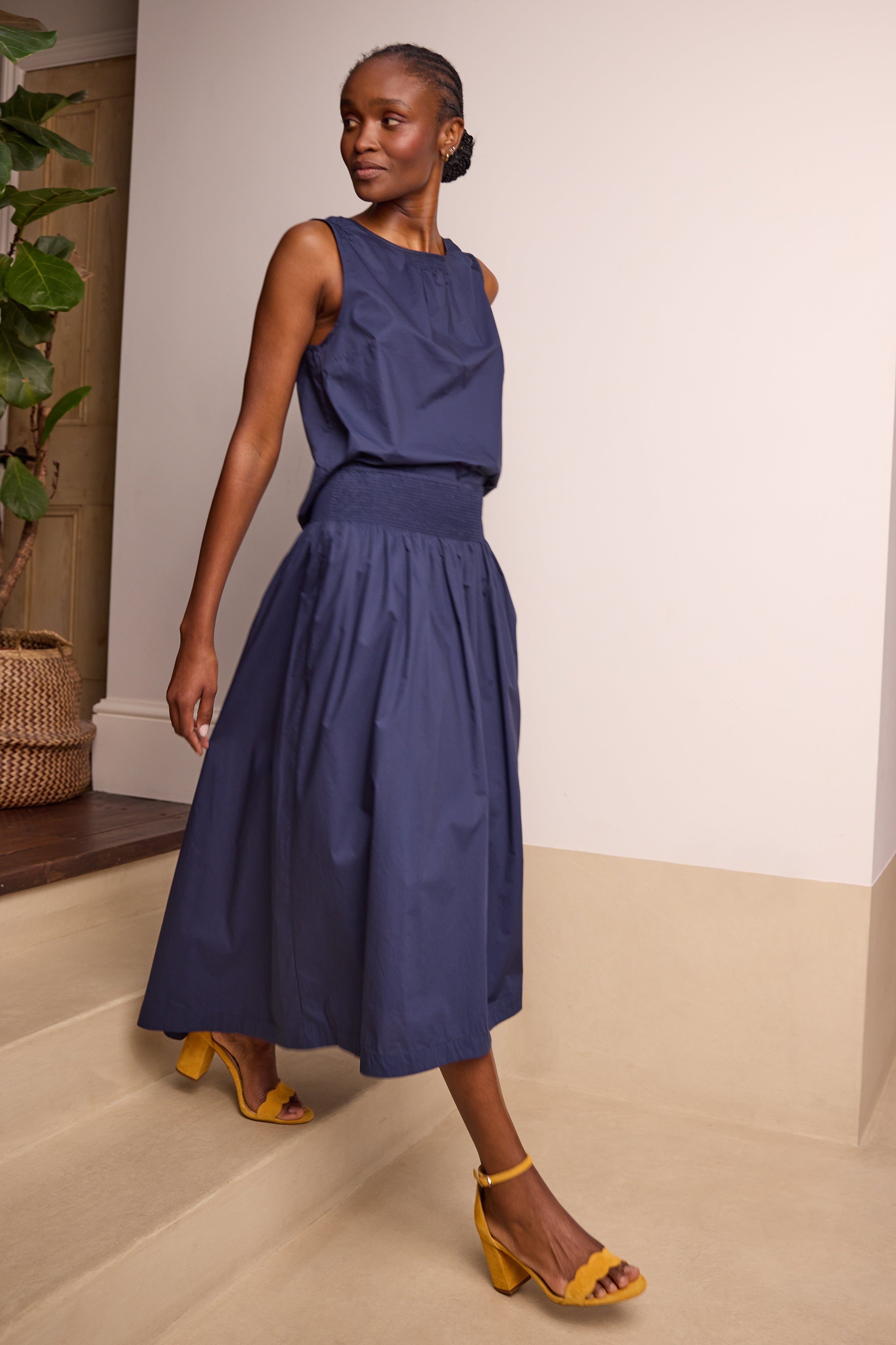 model wearing Drew Dipped Hem Maxi Skirt Navy Eleven Loves
