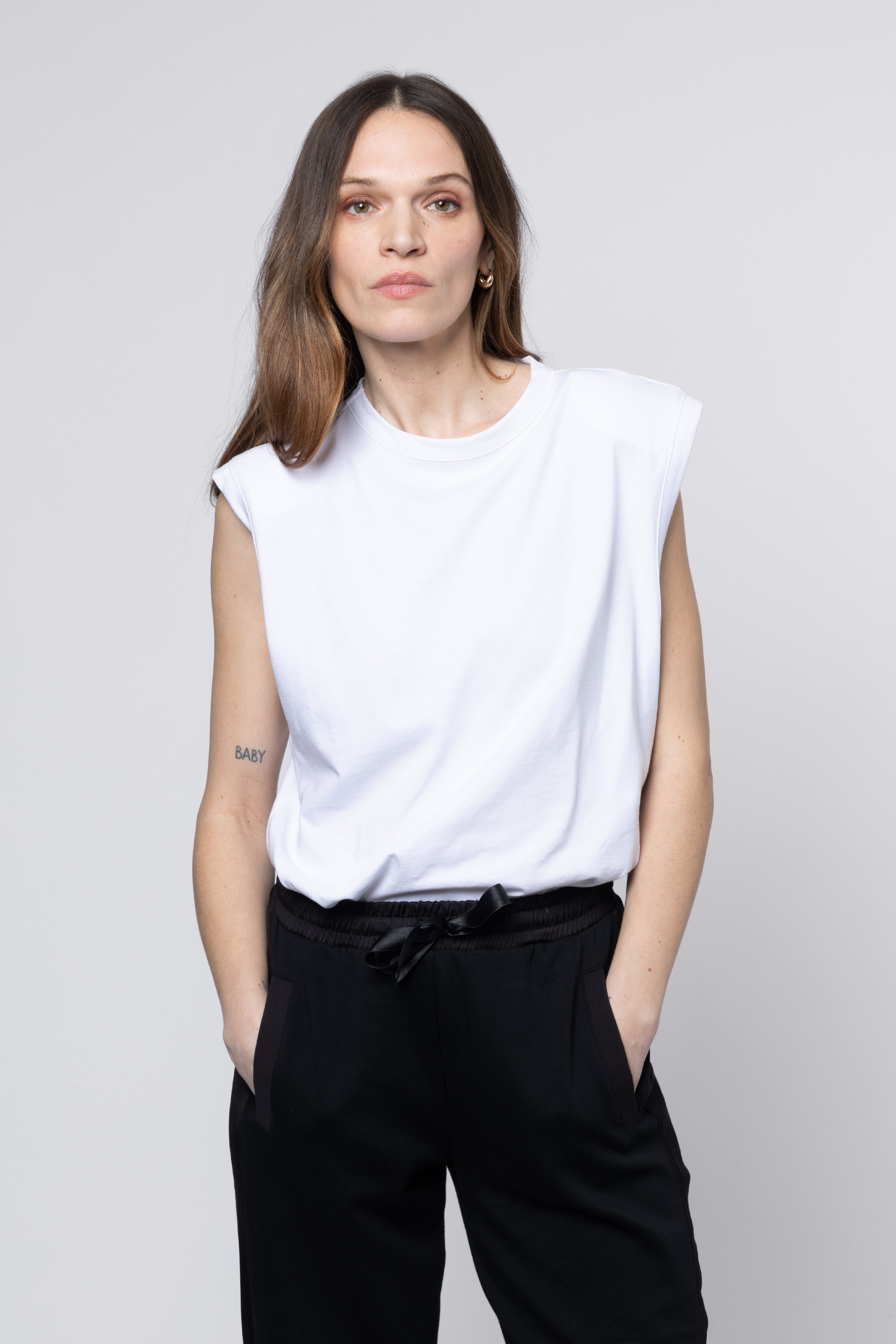 Female Skylar Shoulder Pad T-Shirt 100% Greek certified sustainable FiberMax® Cotton in White Front View