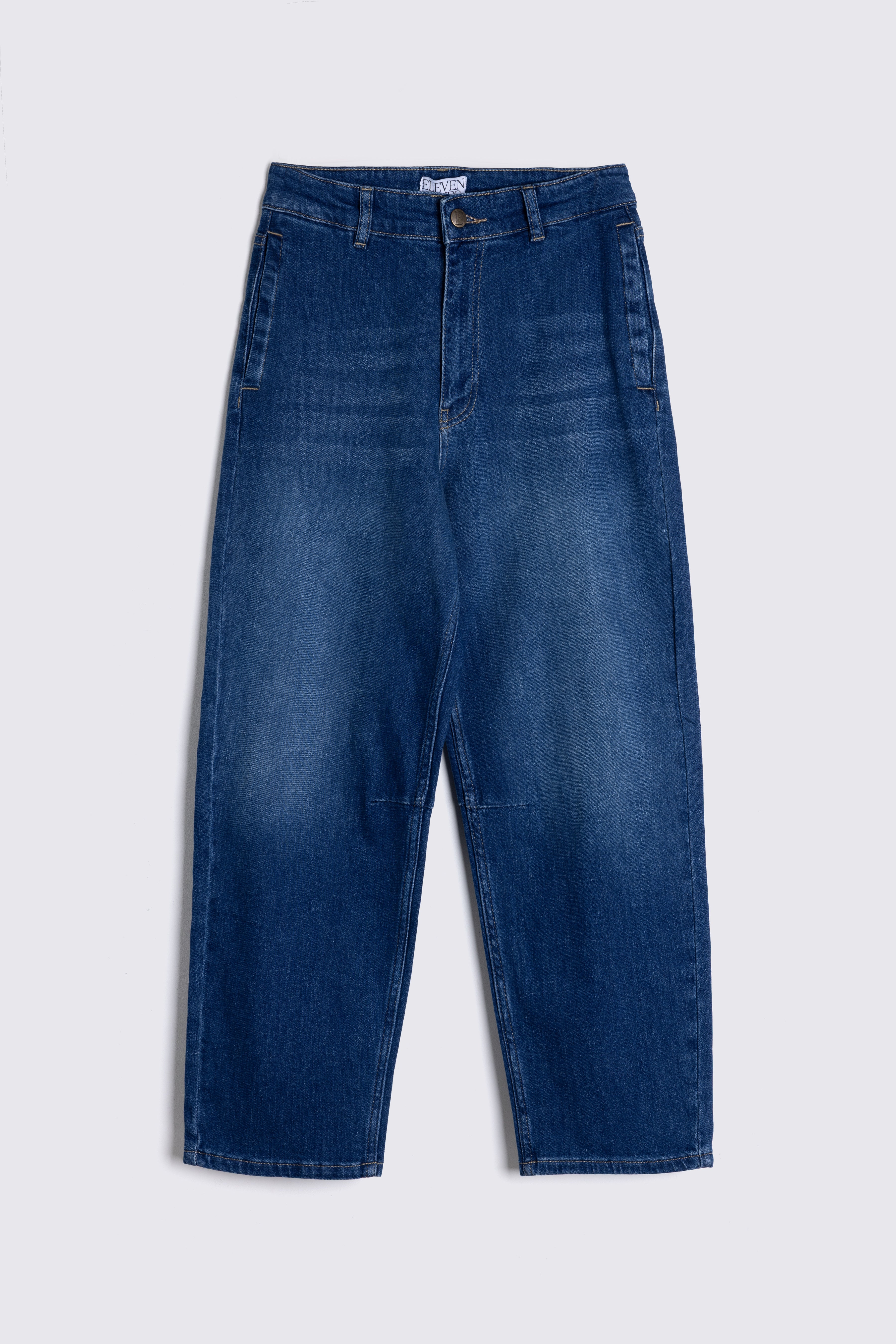 Blue jeans on a light gray background