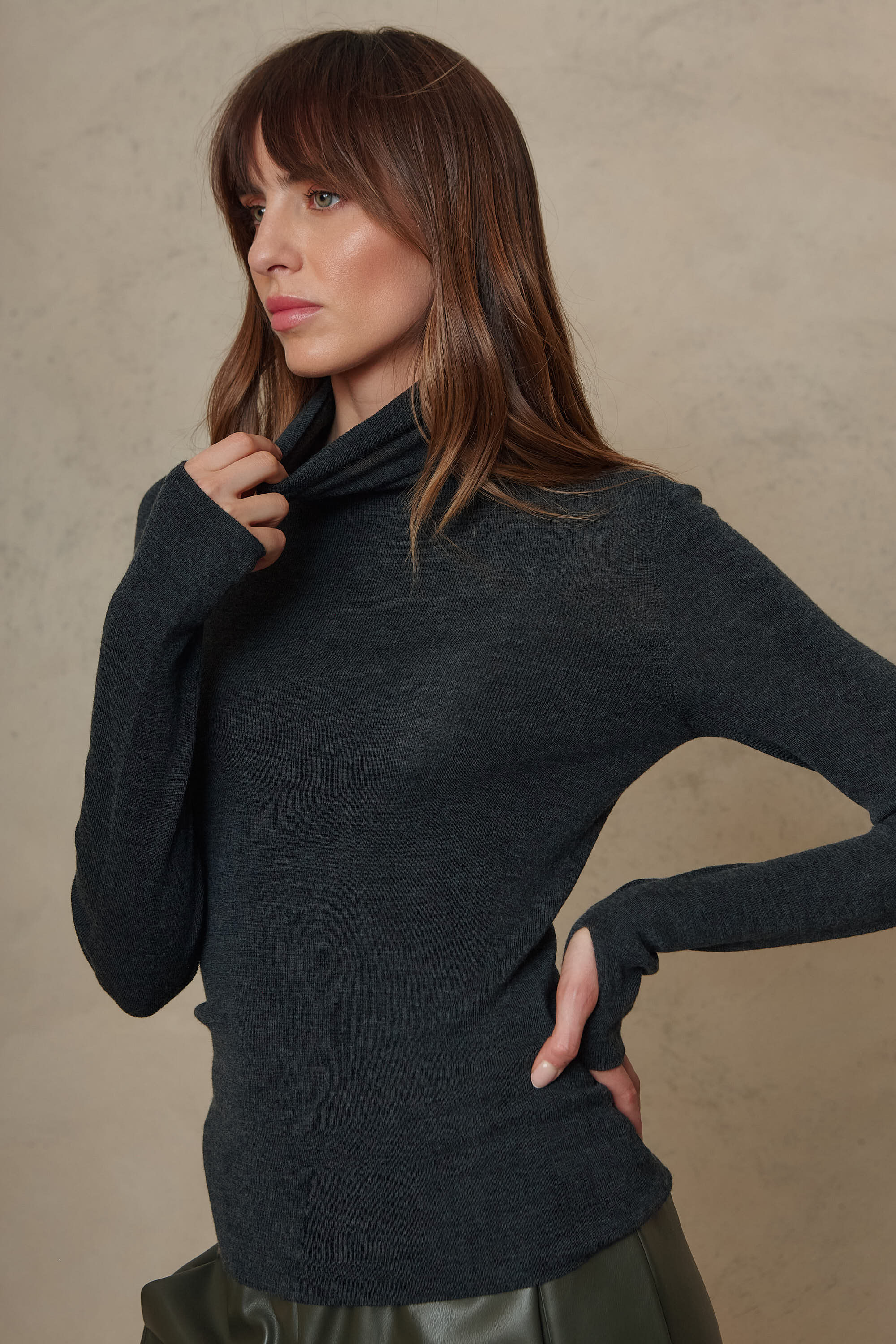 Gwyneth charcoal fine merino roll neck showing the folded roll neck collar