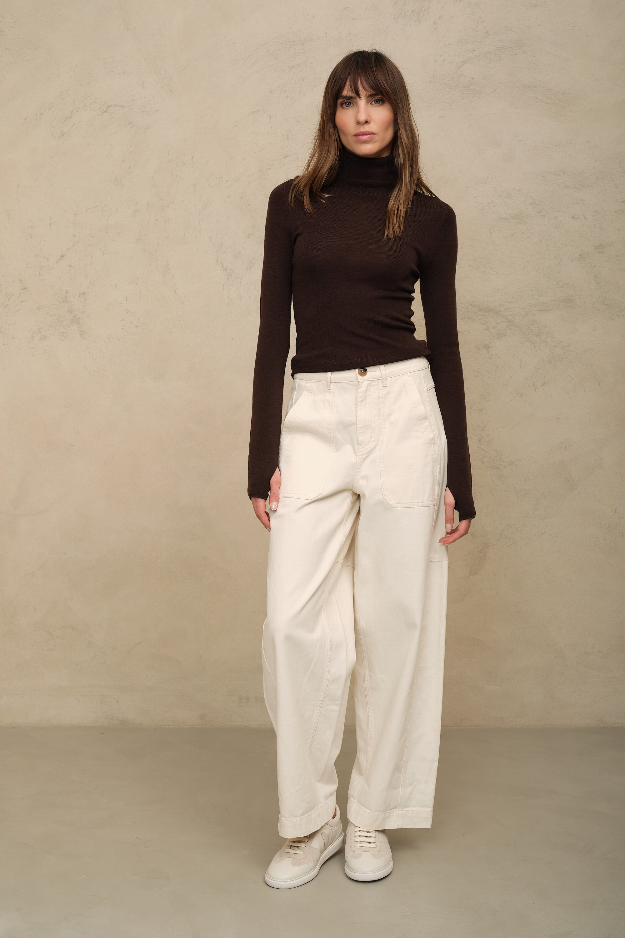 Gwyneth fine merino roll neck in chocolate worn with the Billie barrel leg trousers in ecru