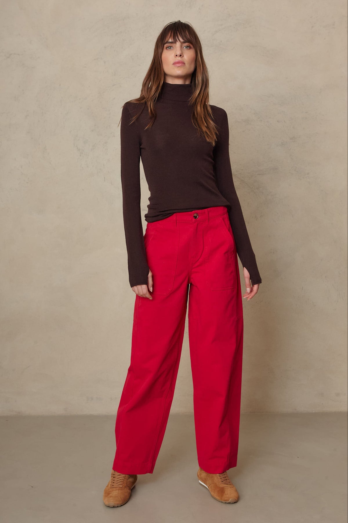 Gwyneth fine merino roll neck in chocolate worn with the Billie barrel leg trousers in red
