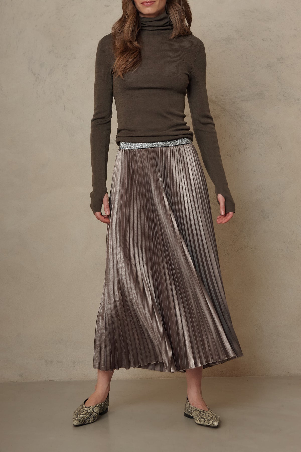 Mia pleated skirt in taupe worn with the Gwyneth fine merino roll neck in dark olive