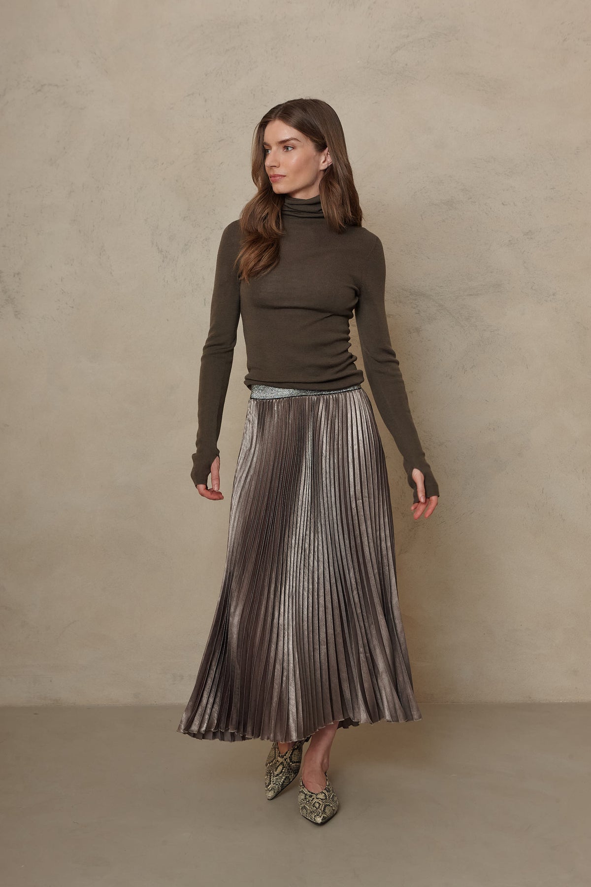 Mia pleated skirt in taupe worn with the Gwyneth fine merino roll neck in dark olive