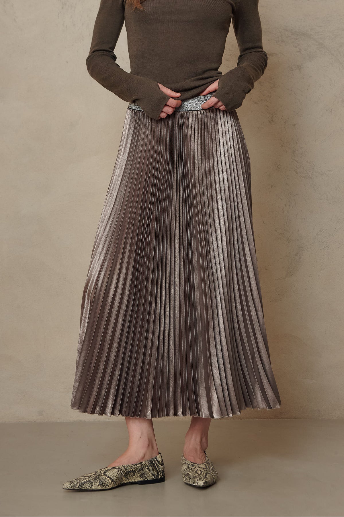 Mia pleated skirt in taupe worn with the Gwyneth fine merino roll neck in dark olive
