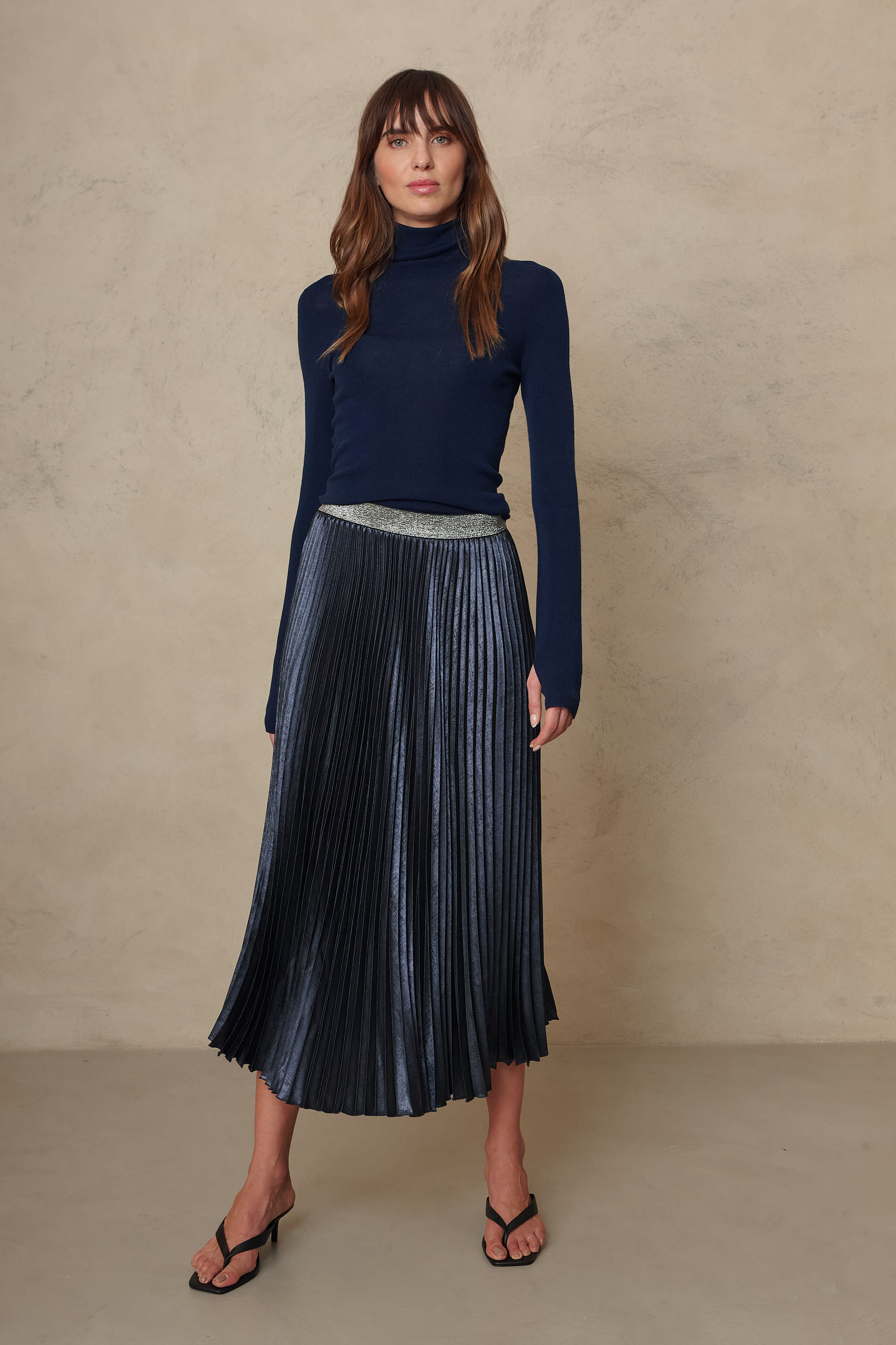 Gwyneth fine merino roll neck in navy worn with the Mia pleated skirt in navy