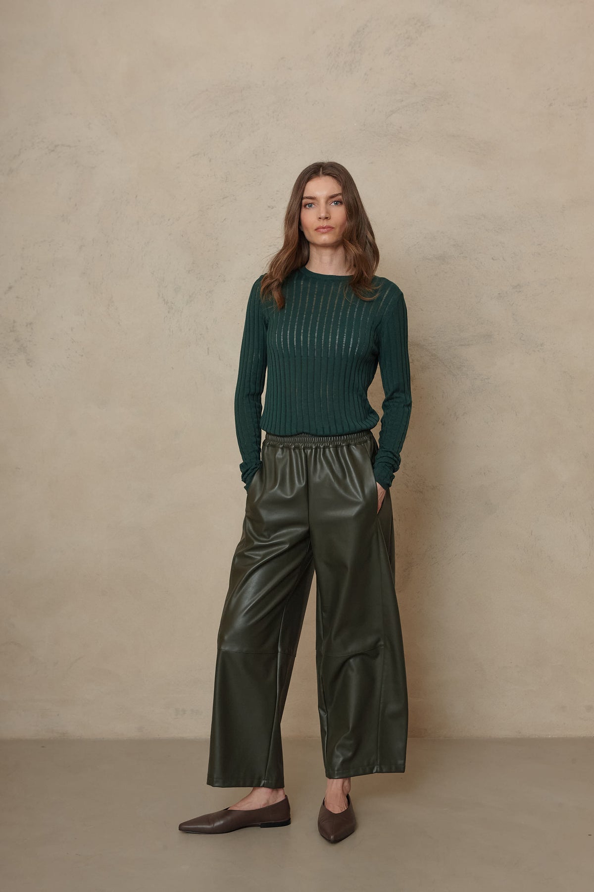 Iggy bottle green sheer rib jumper styled with the Billie faux leather trousers in olive