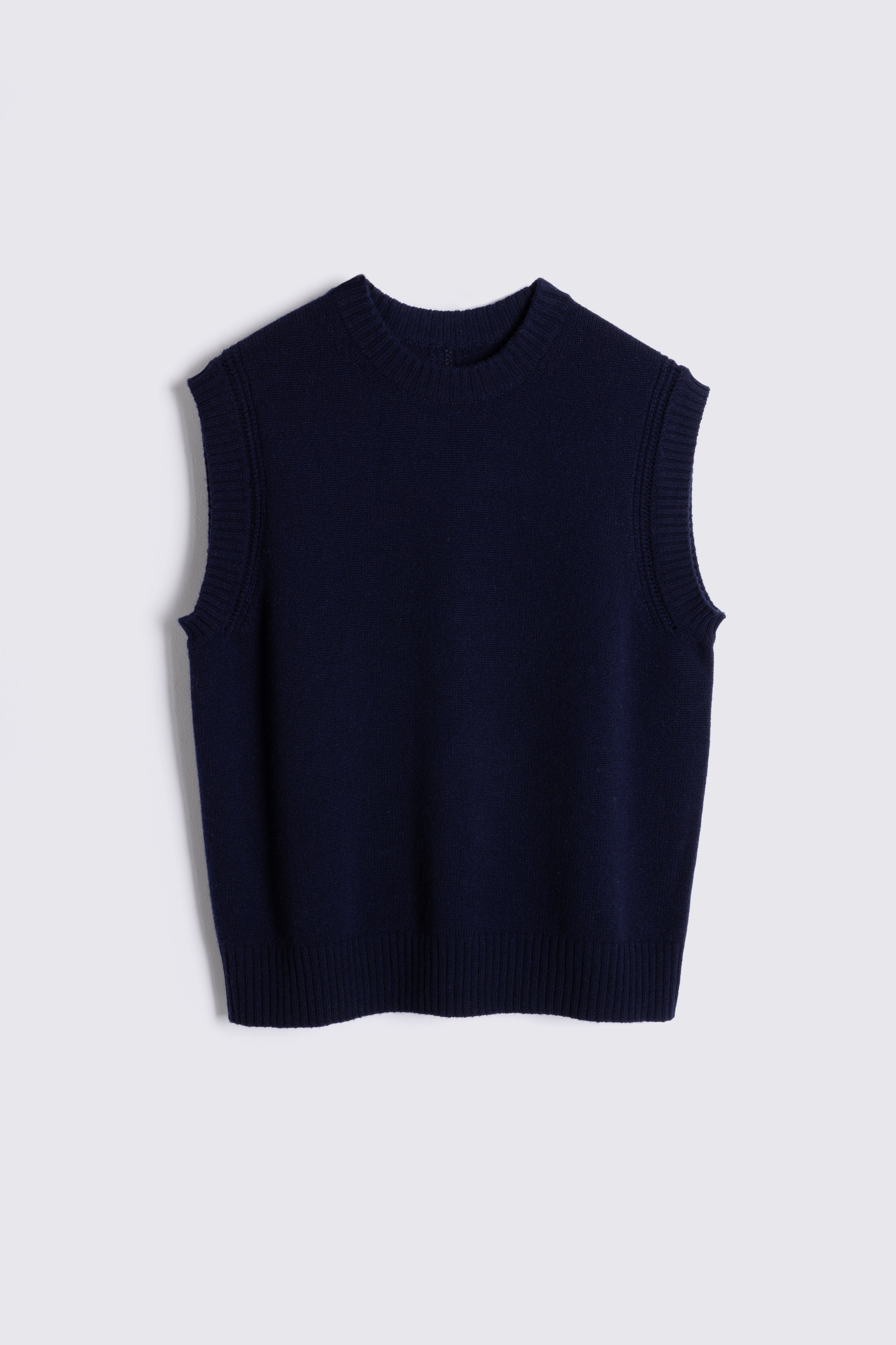 Navy sleeveless sweater on a light gray background
