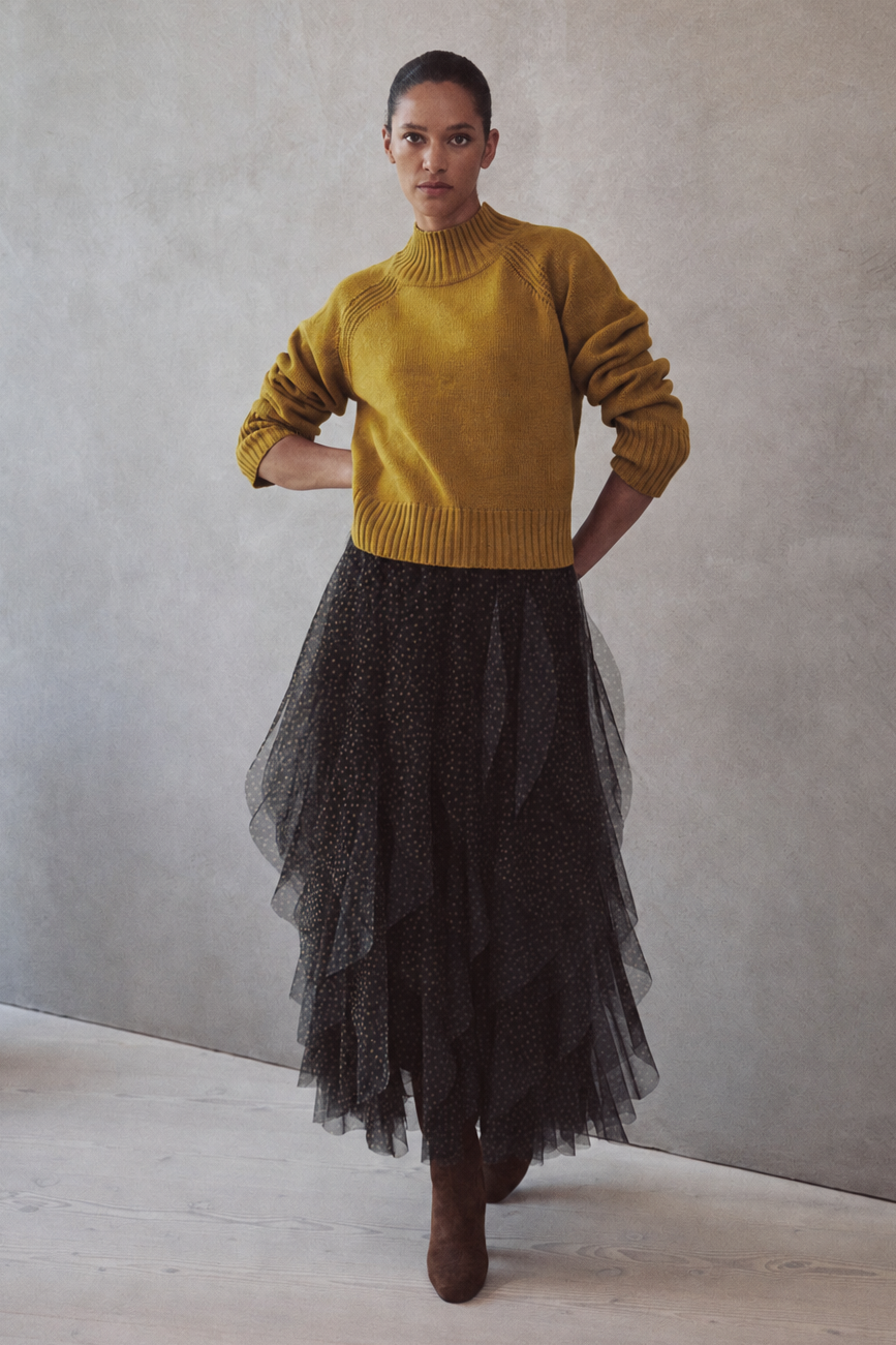 Blythe funnel neck cropped jumper in turmeric worn with the Iris tulle maxi skirt in spot