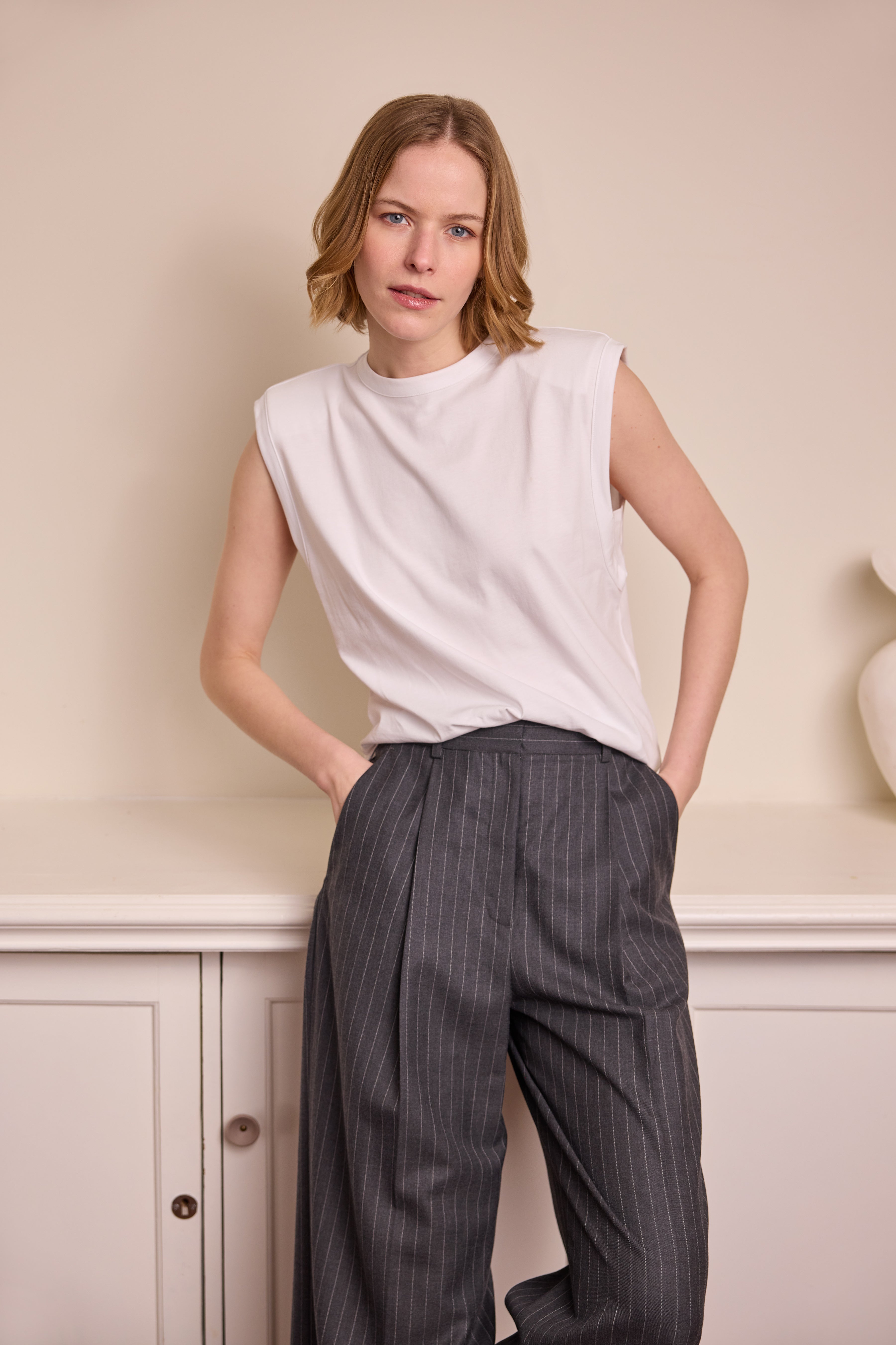 model wearing Skylar Shoulder Pad T Shirt Eleven Loves