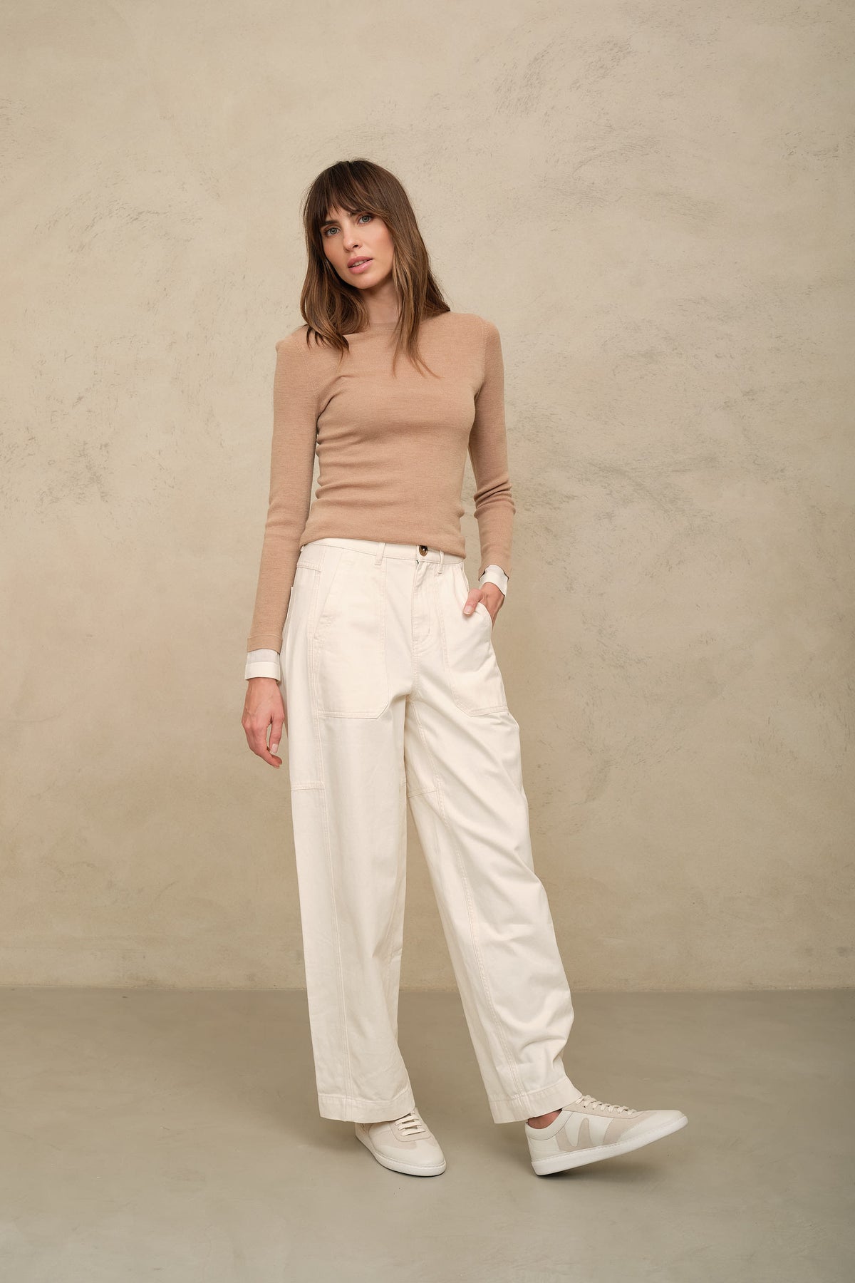 Trinny fine merino crewneck in camel with an ivory sleeve worn with the Billie barrel leg trousers in ecru