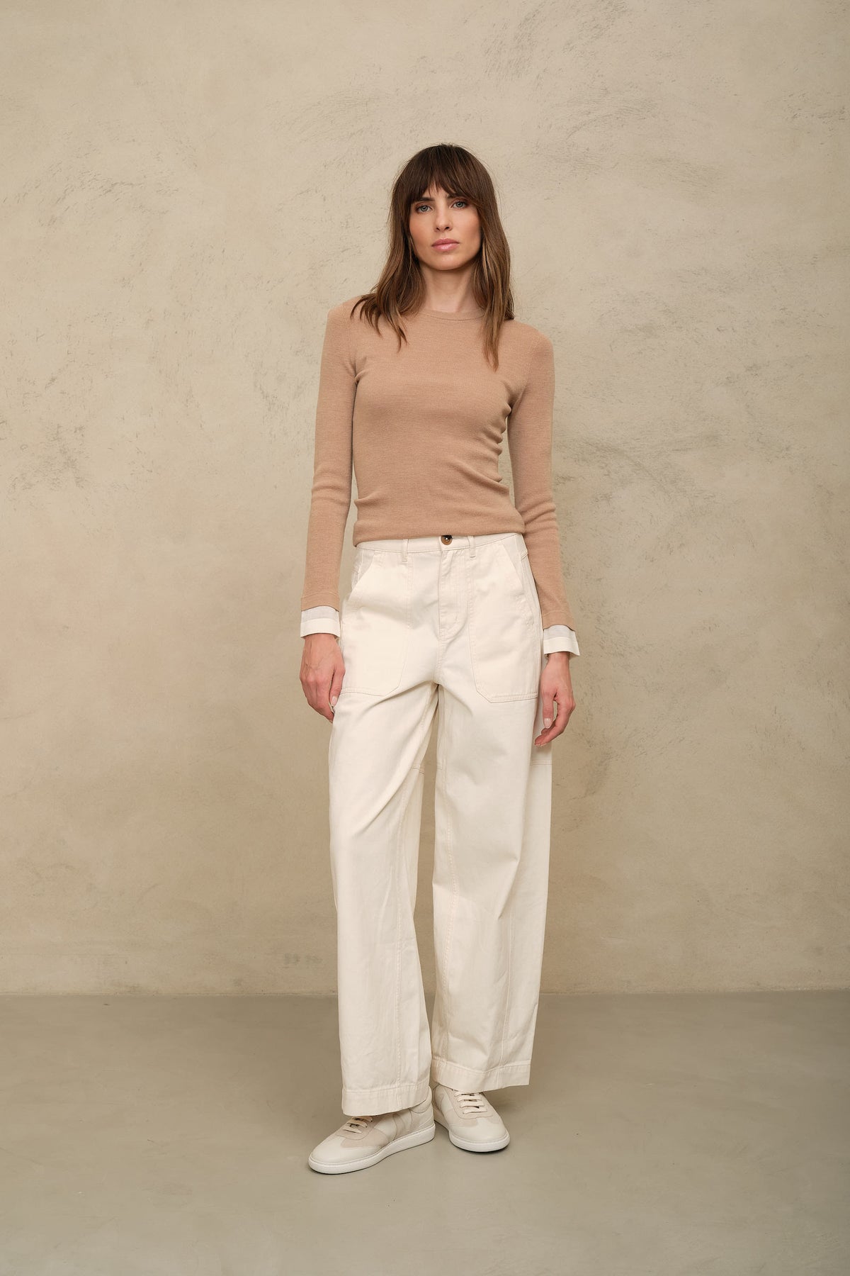 Trinny fine merino crewneck in camel with an ivory sleeve worn with the Billie barrel leg trousers in ecru