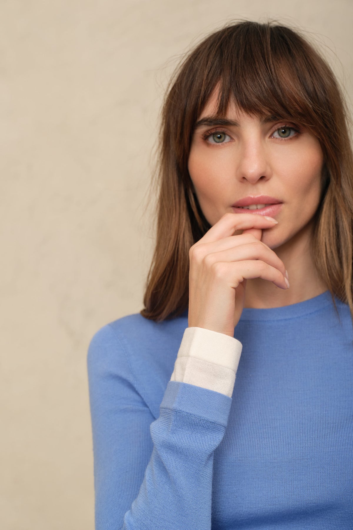 Trinny fine merino crewneck in sky blue with an ivory sleeve