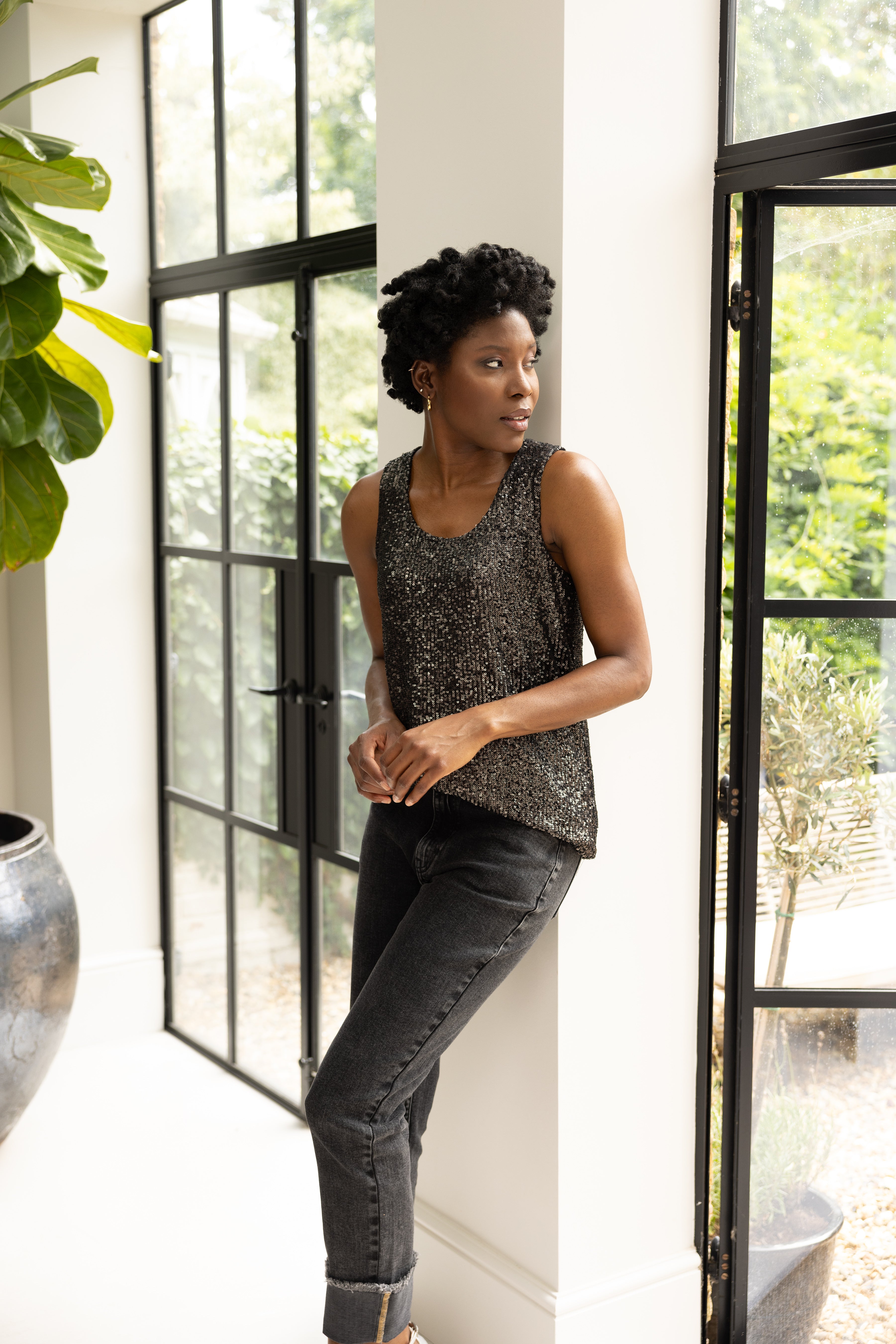 model wearing sequin vest and trousers