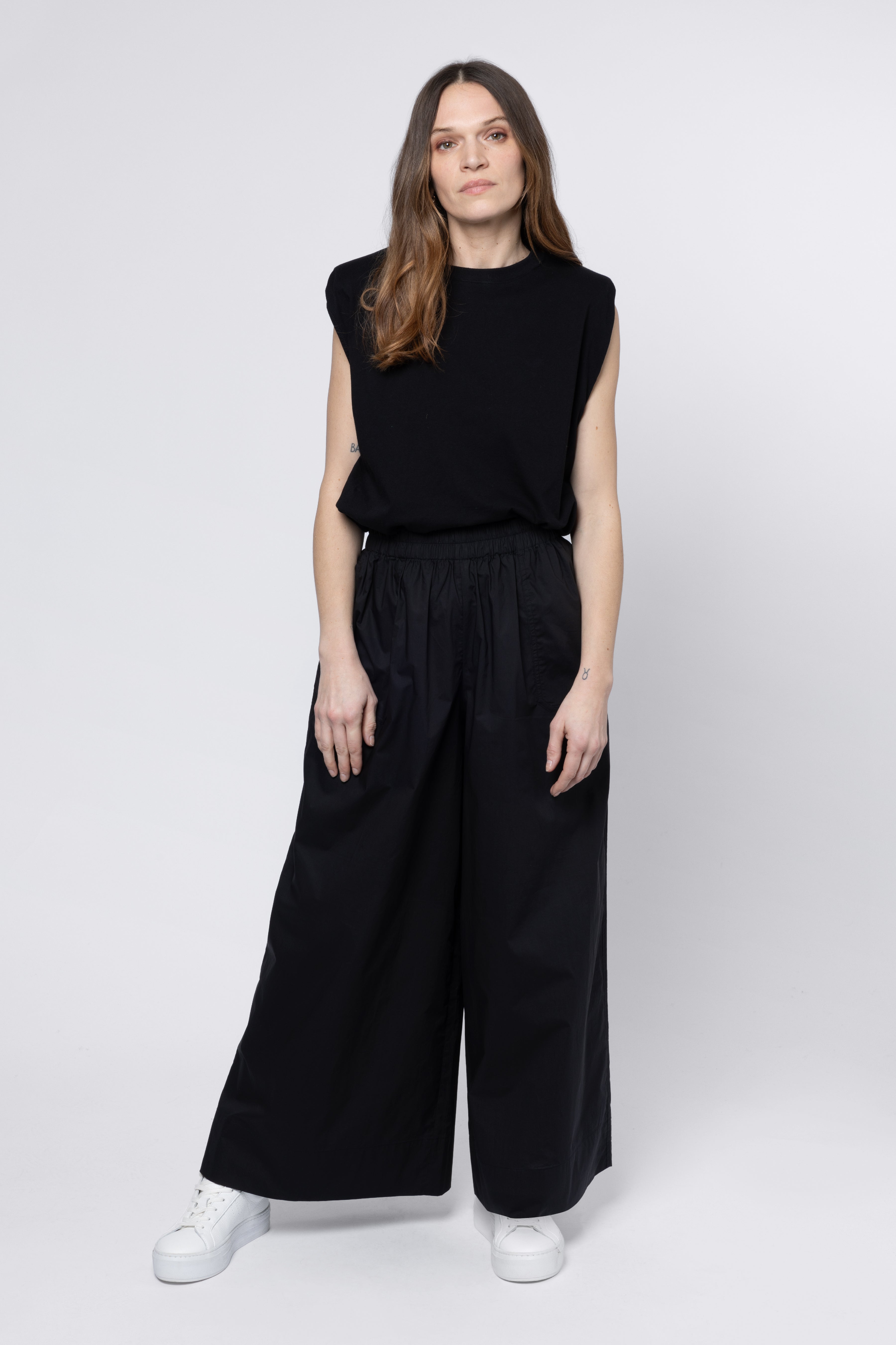 model wearing wide leg trousers black eleven loves
