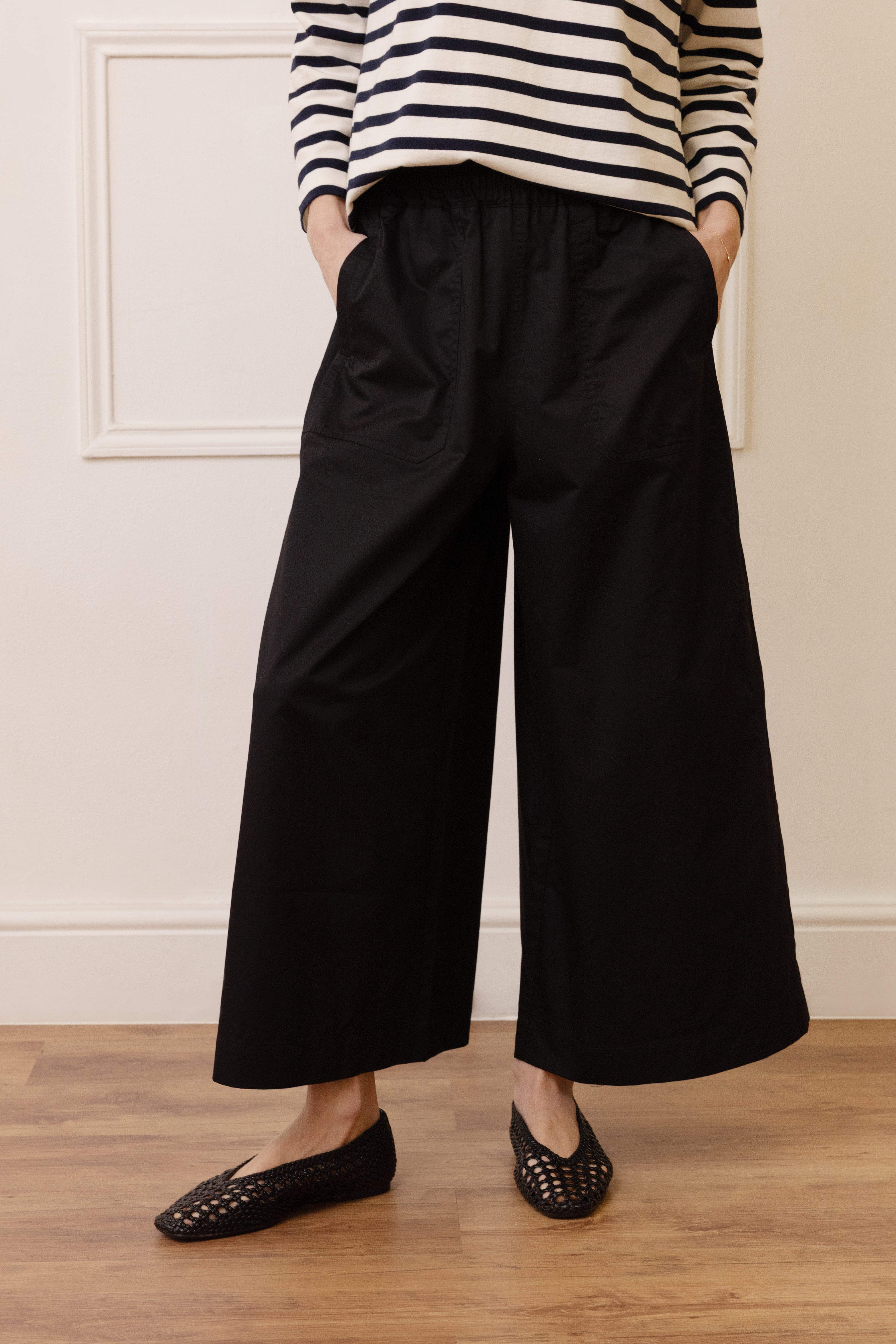An Eleven Loves summer capsule wardrobe outfit with cropped wide leg trousers and a neat top