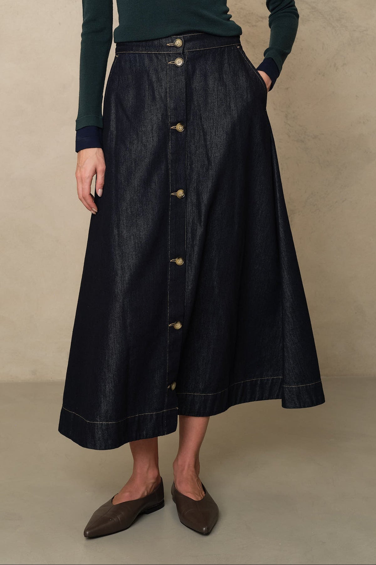 Jumper and skirt outfit: the Imogen denim skirt in dark wash with a green fine knit and pointed flats