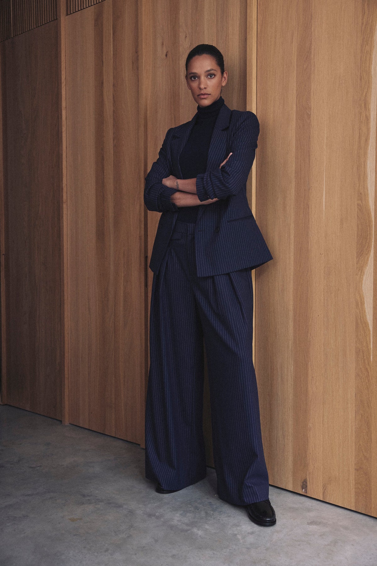 Navy pinstripe suit, the Dora wide leg trousers with the Georgia blazer and a navy merino roll neck