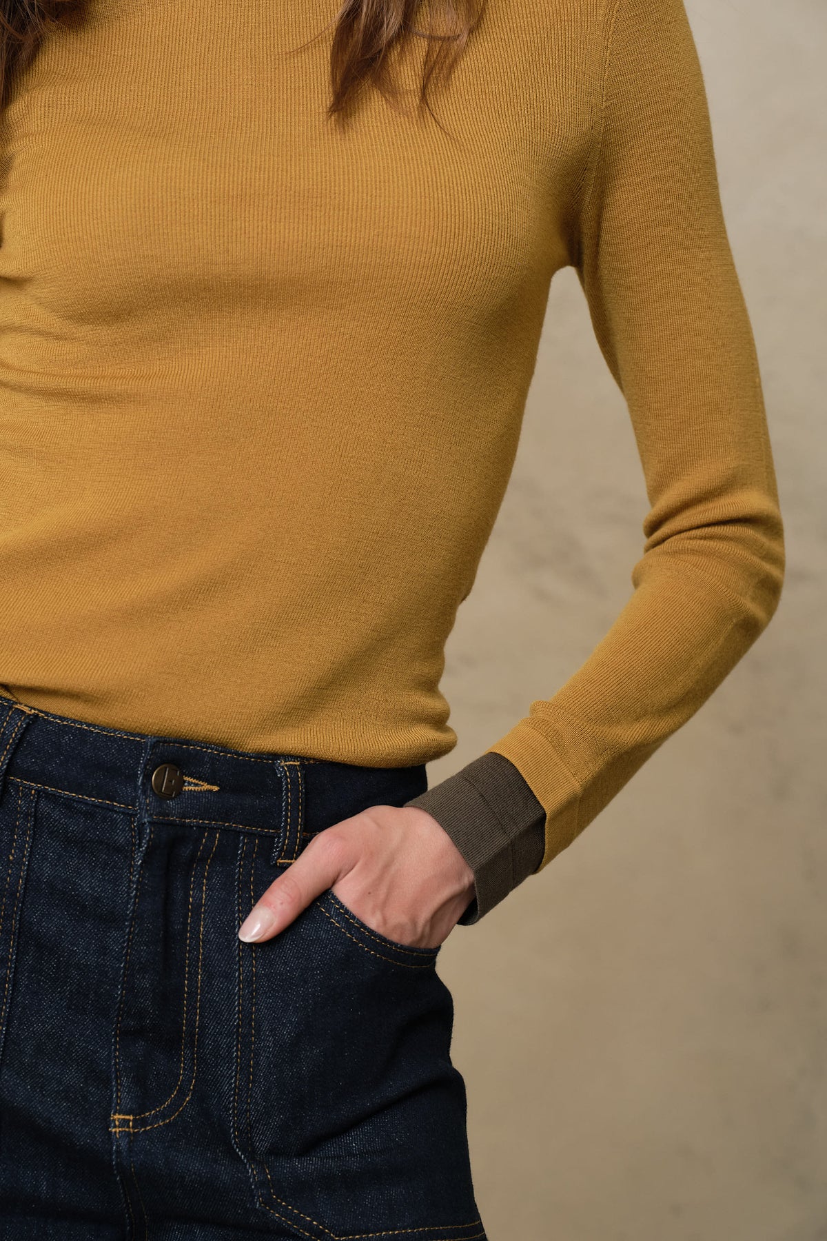 Trinny fine merino crewneck in mustard with a dark olive sleeve