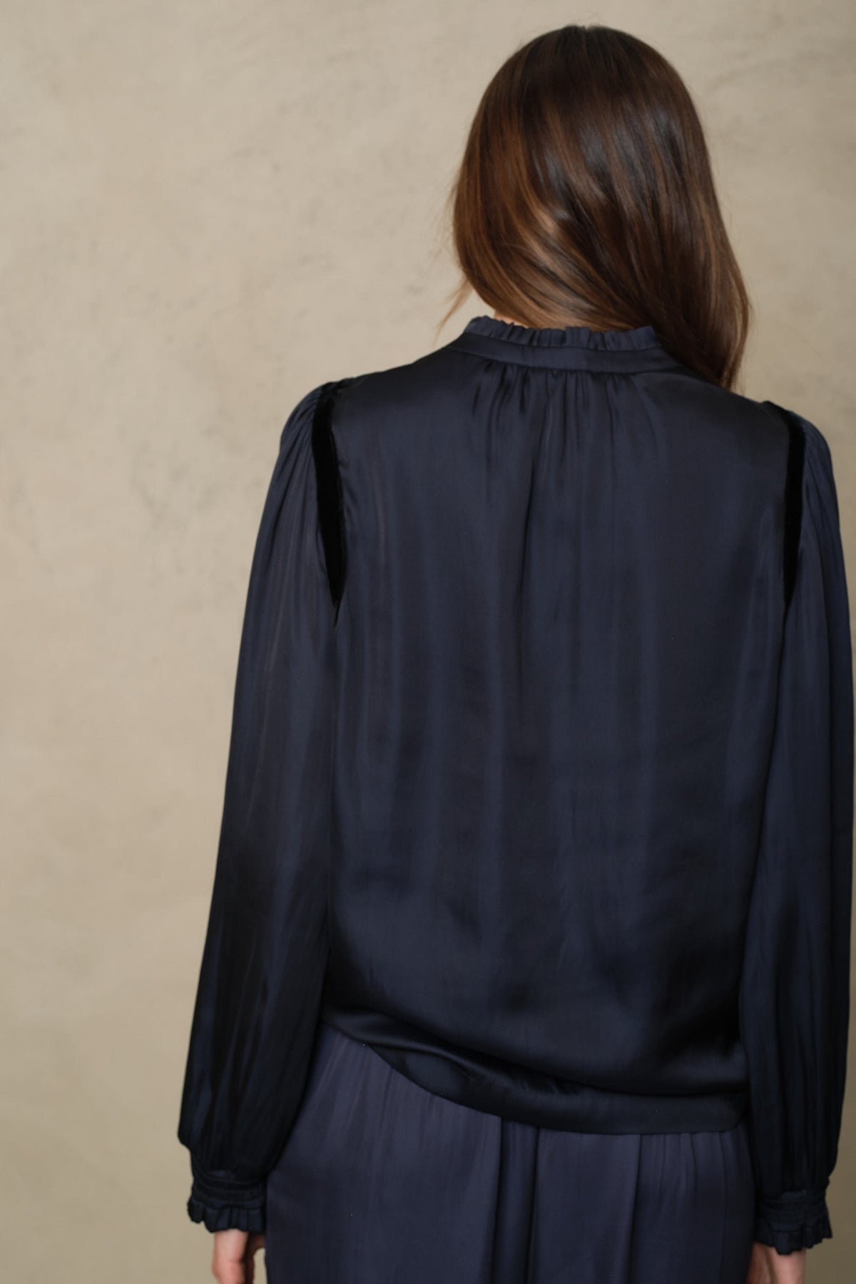 Back view of the Jules blouse in navy showing the gathered yoke