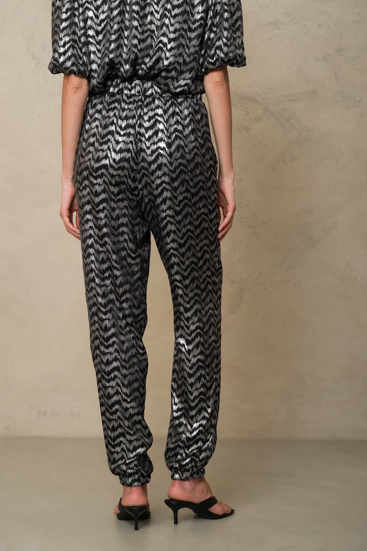 Back of the Florence silver print trousers, showing the elasticated cuff