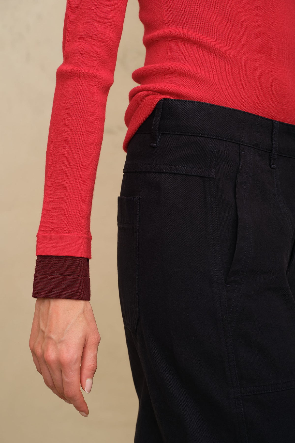 Trinny fine merino crewneck in red with a burgundy sleeve