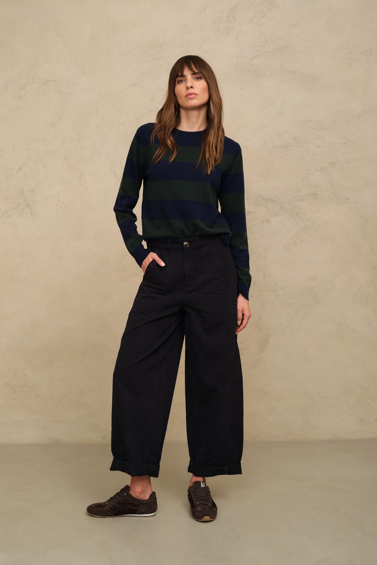 Camille striped jumper in navy and bottle green with black wide leg trousers and loafers