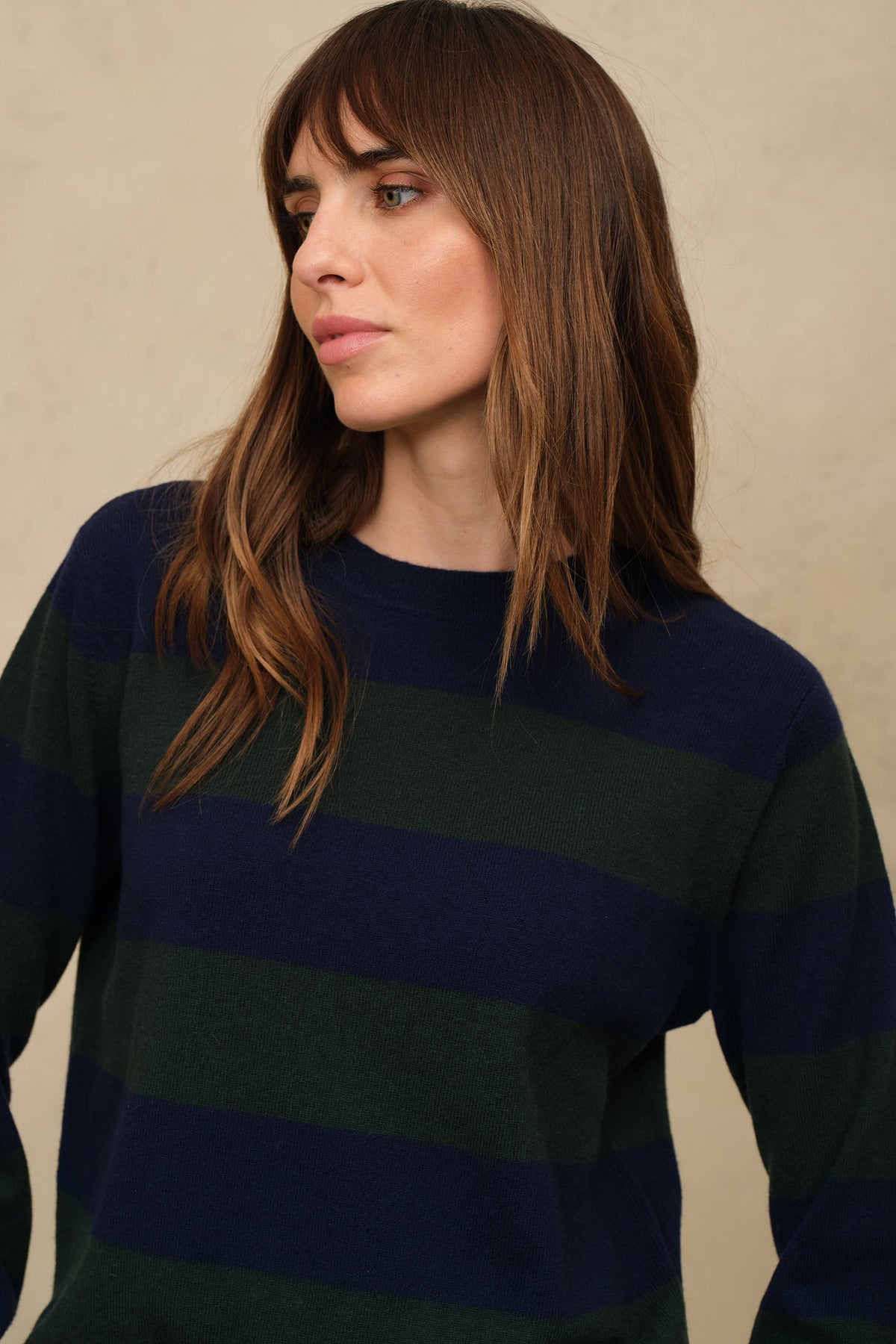 Close view of the navy and bottle green stripe and the crew neck tipping