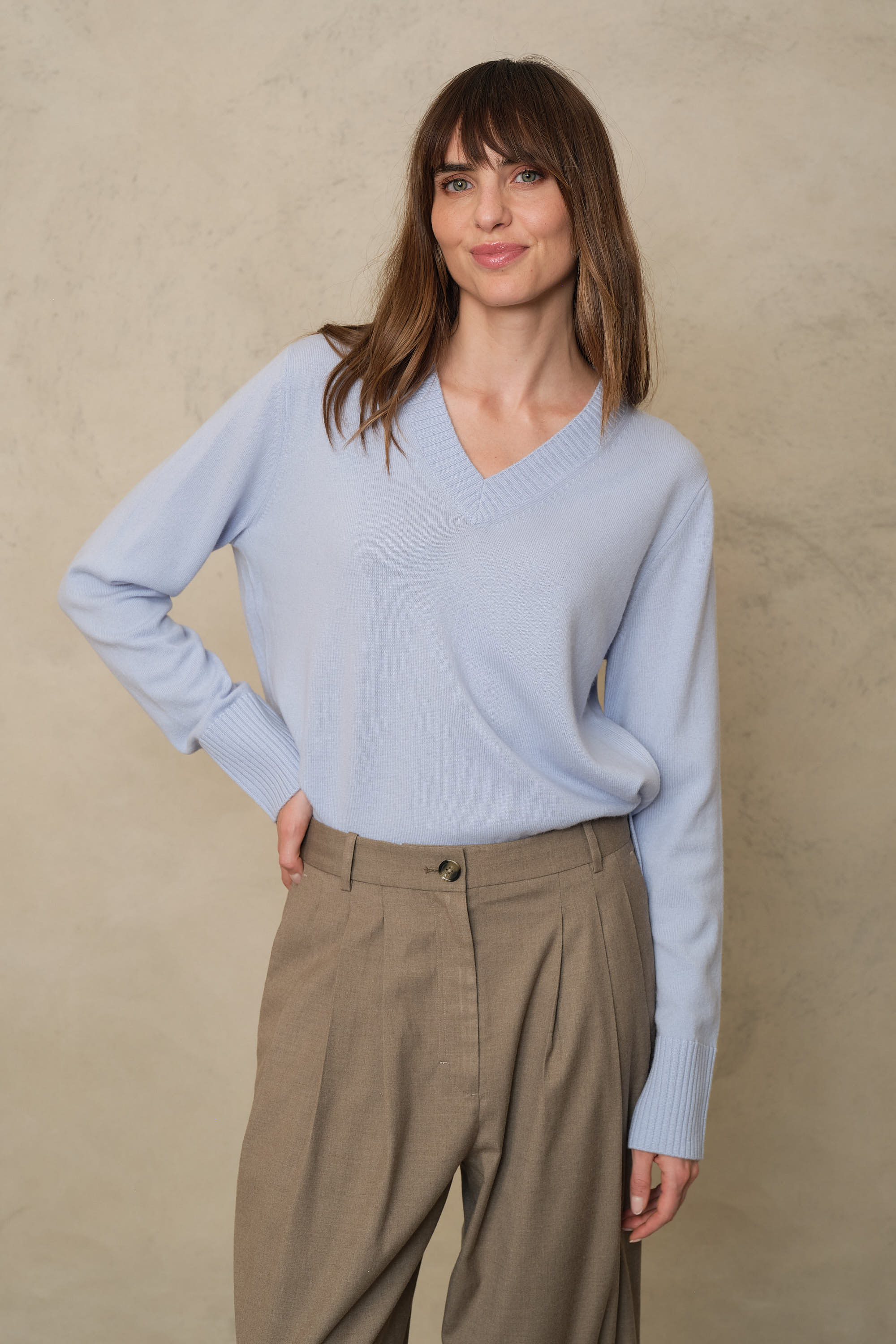 Sky blue cashmere blend V neck jumper, showing the relaxed body and deep ribbed trims