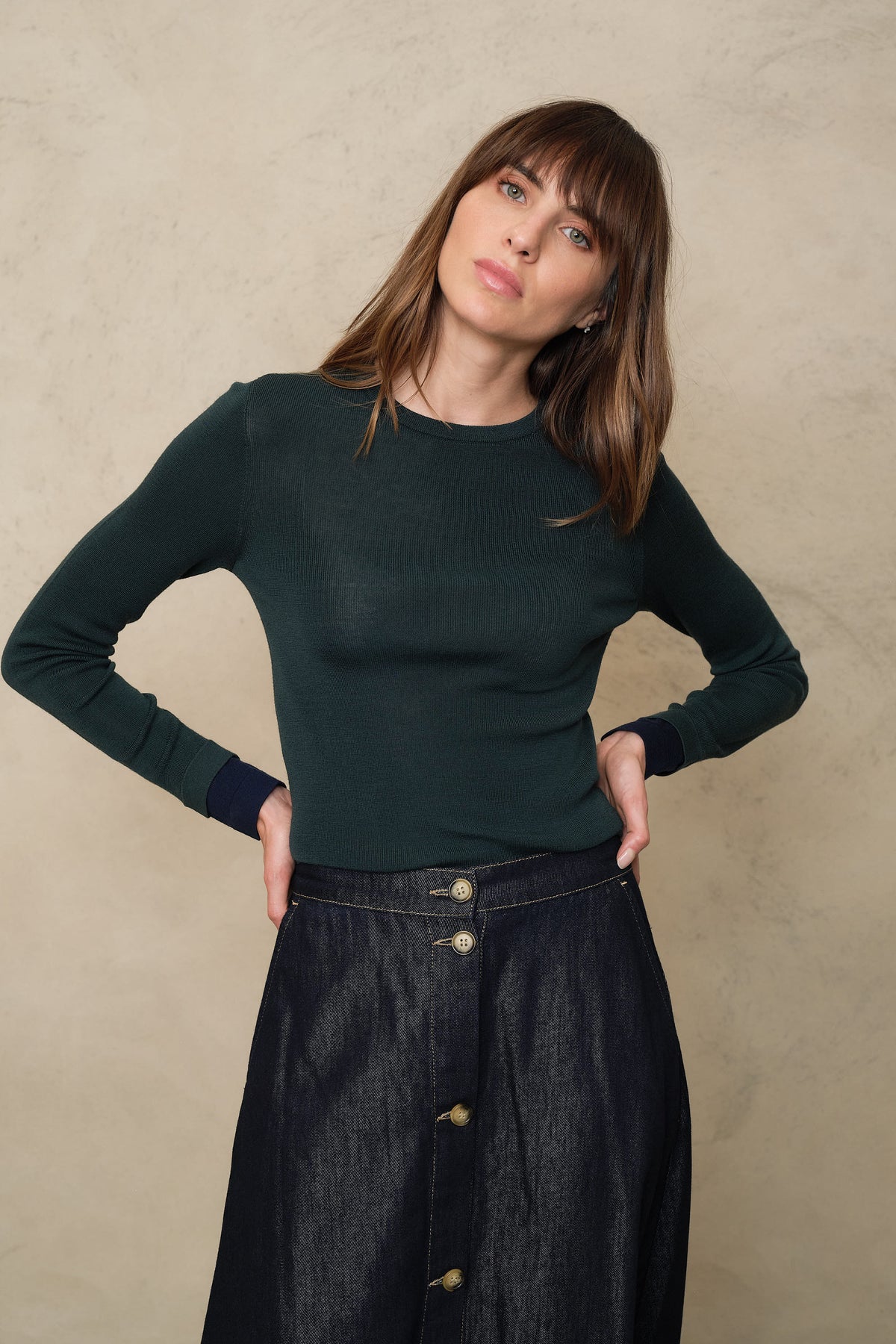 Trinny fine merino crewneck in bottle green with a navy sleeve