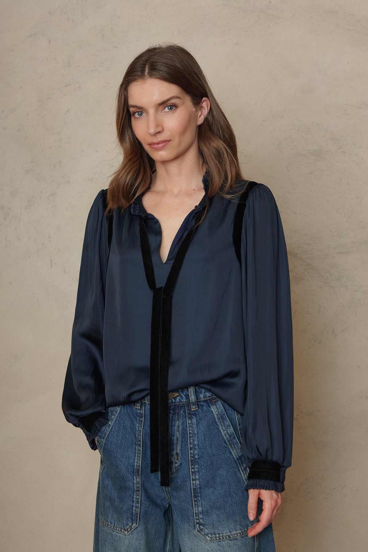 Jules blouse in navy worn with blue wide leg jeans, front view