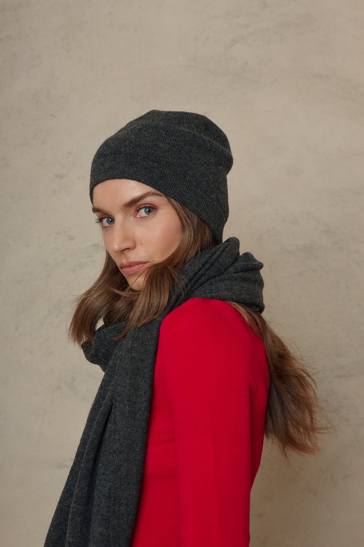 Carmel cashmere blend scarf in charcoal with the Zinnie beanie in charcoal, three quarter view