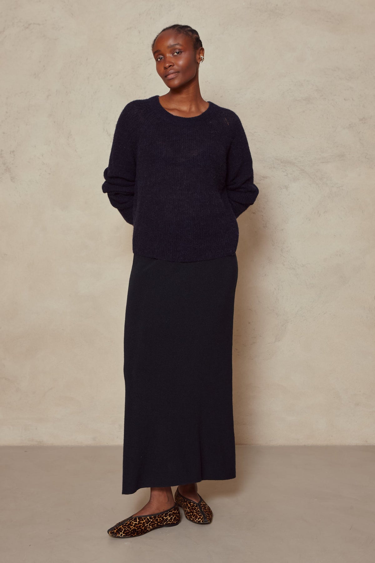 Felicity loose knit jumper in navy worn with a navy maxi skirt and leopard flats, full length