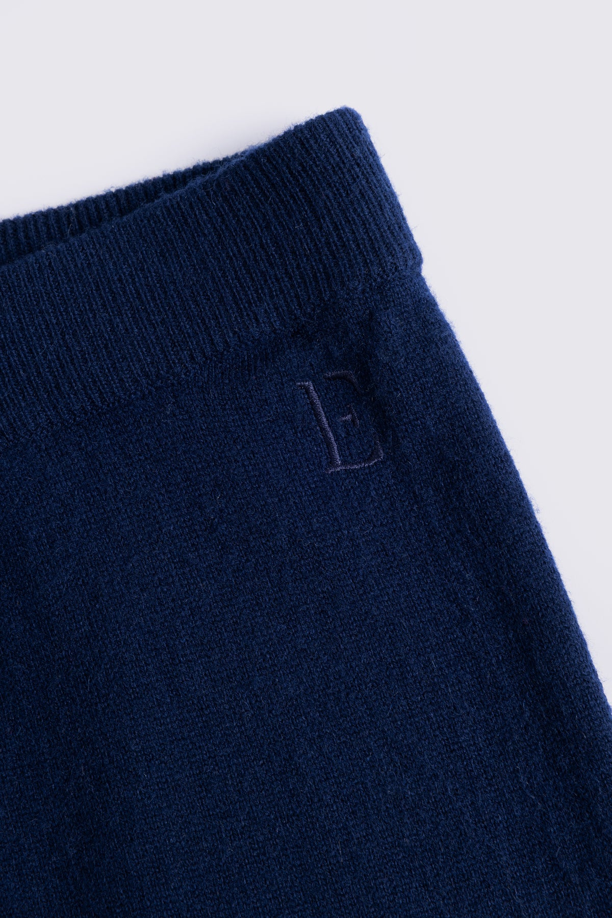 Navy knitted joggers in a wool and cashmere blend, shown flat