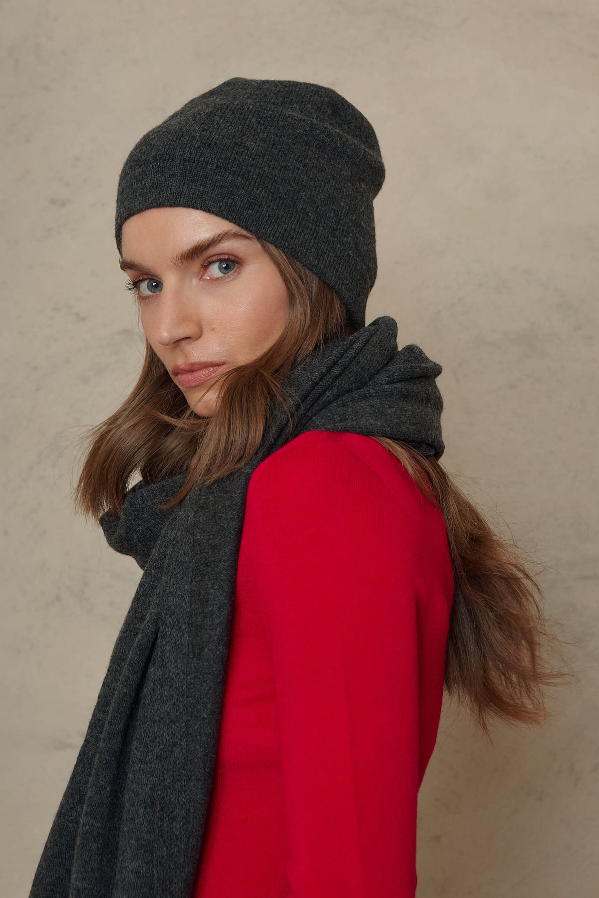 Zinnie cashmere blend beanie in charcoal worn with the Carmel cashmere blend scarf in charcoal