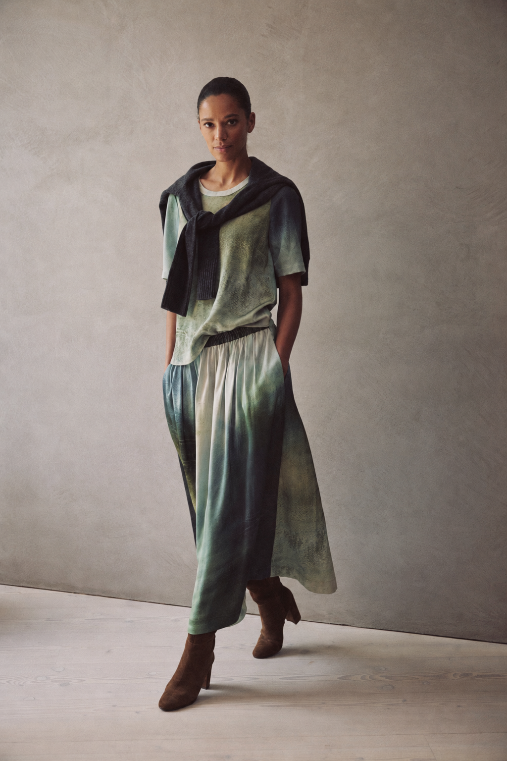 Faye art print satin T Shirt styled with a charcoal knit over the shoulders, the Saffy printed midaxi skirt and brown suede ankle boots