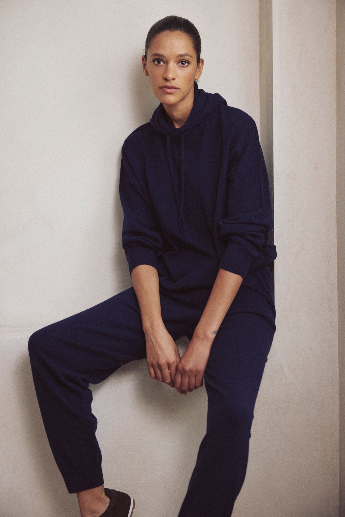 Antonia cashmere blend joggers in navy worn with the Heidi cashmere blend hoodie in navy