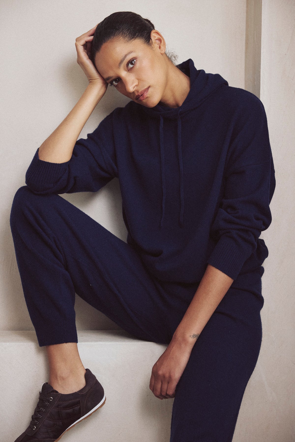 Antonia cashmere blend joggers in navy worn with the Heidi cashmere blend hoodie in navy