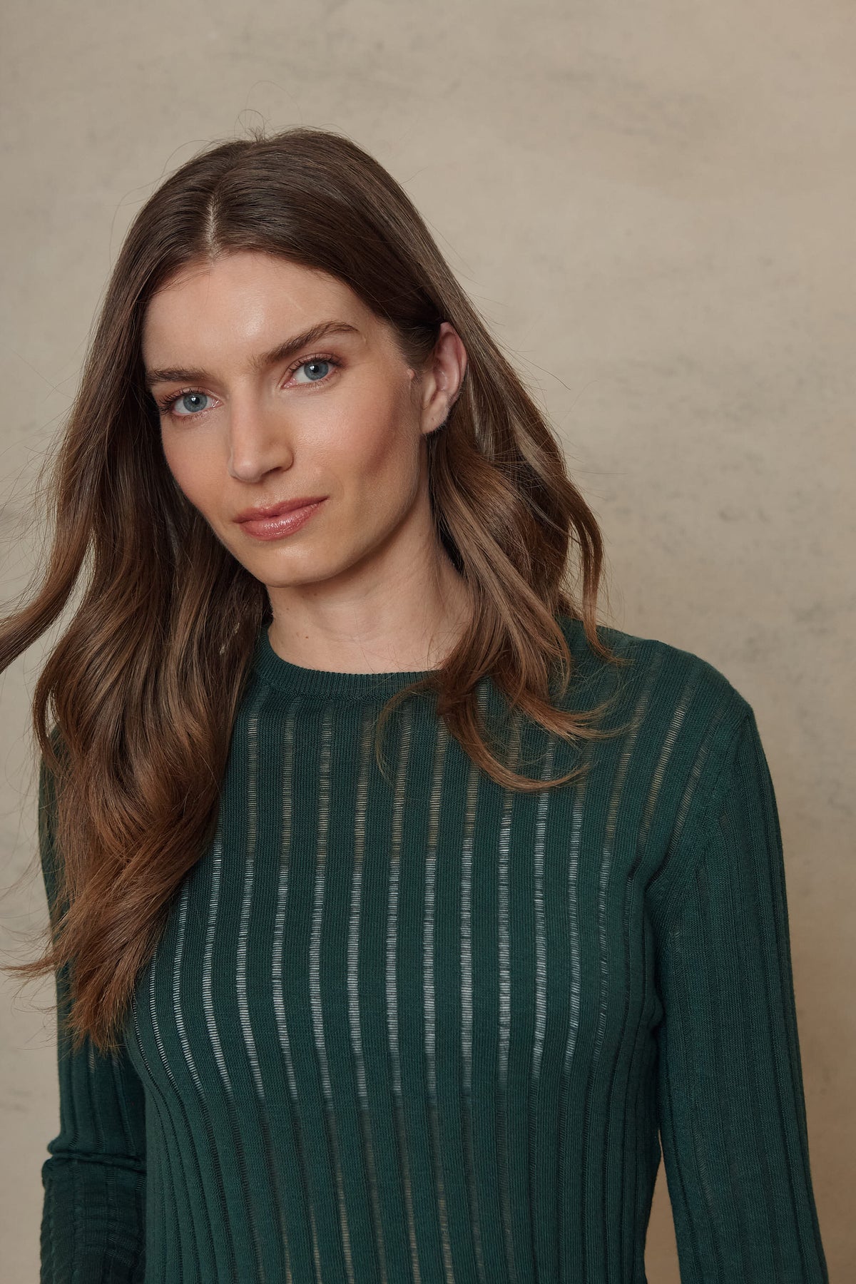 Iggy bottle green sheer rib jumper showing the crew neck and slim fit