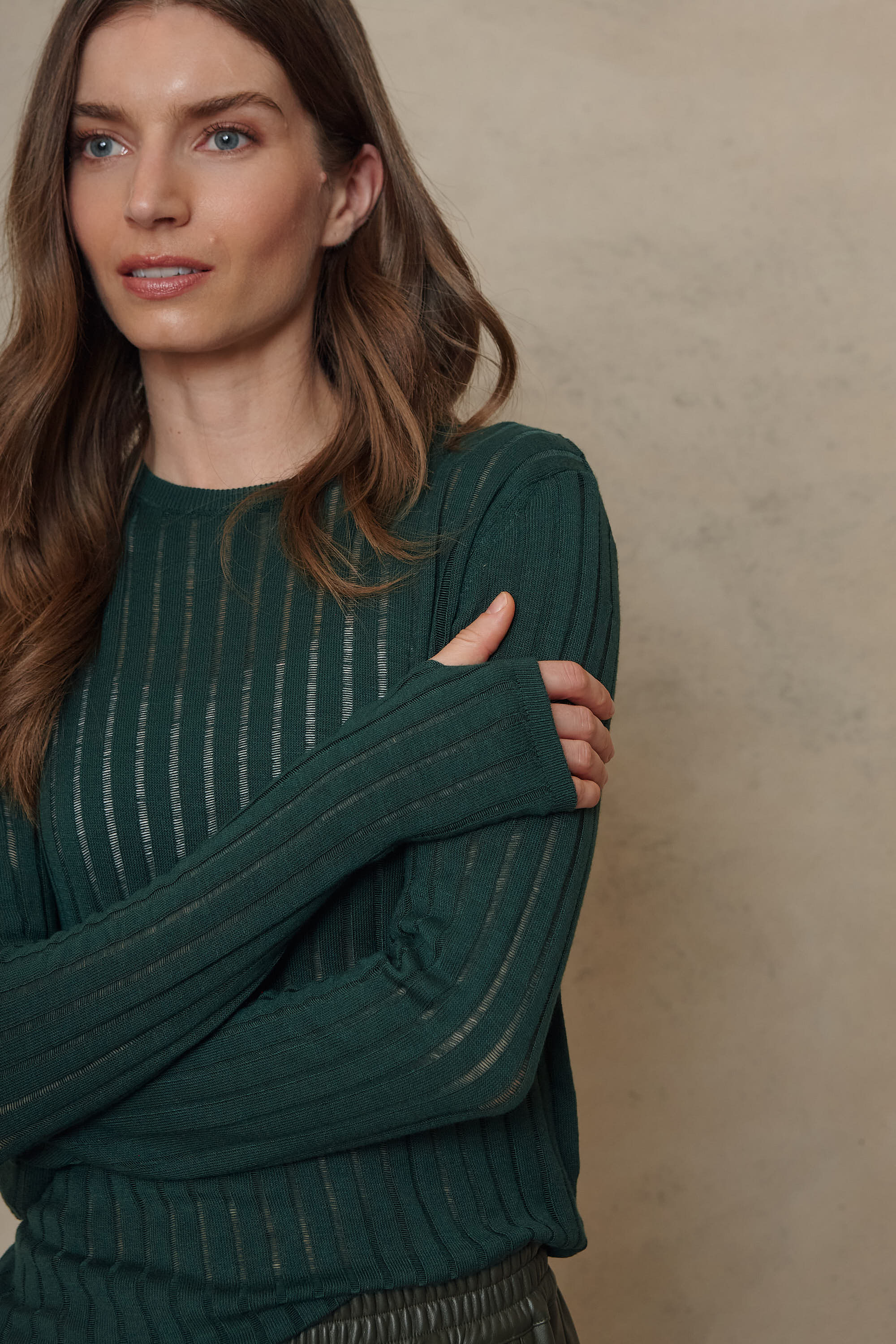 Iggy bottle green sheer rib jumper sleeve and cuff detail, close up