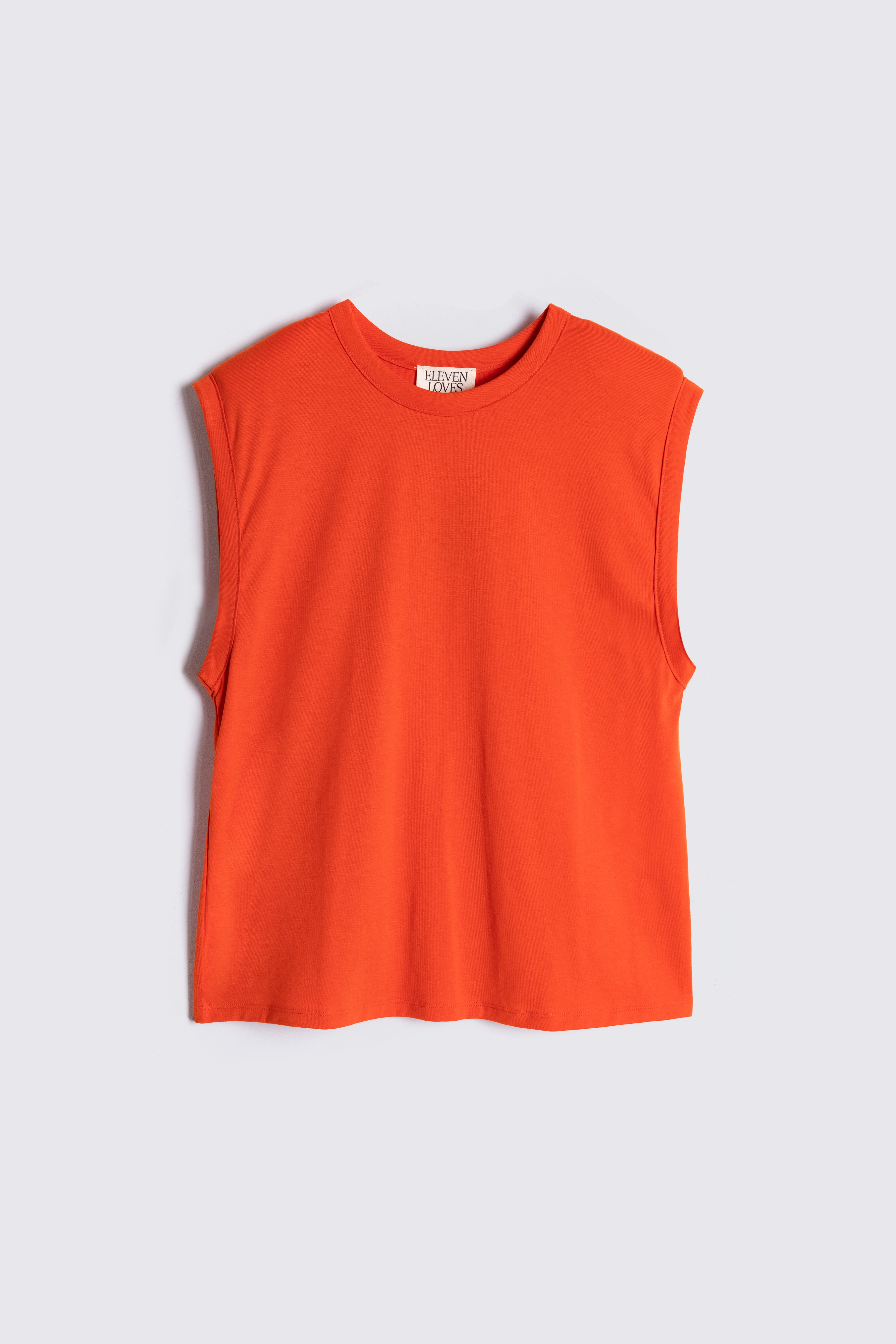 Orange sleeveless top on a light gray background
