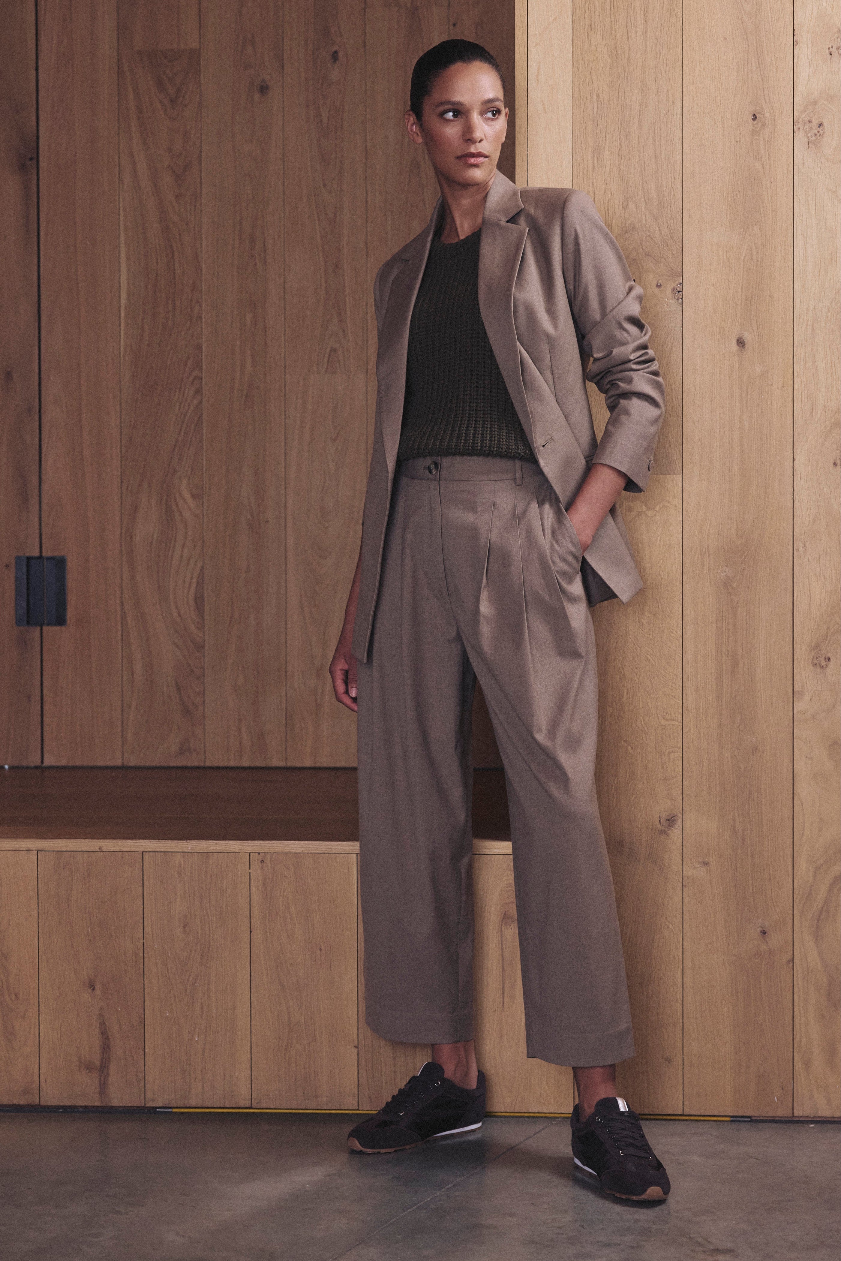 Eadie taupe trousers with the matching Josephine blazer worn as a full taupe suit with black trainers
