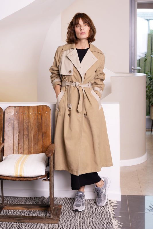 model wearing eleven loves trench coat