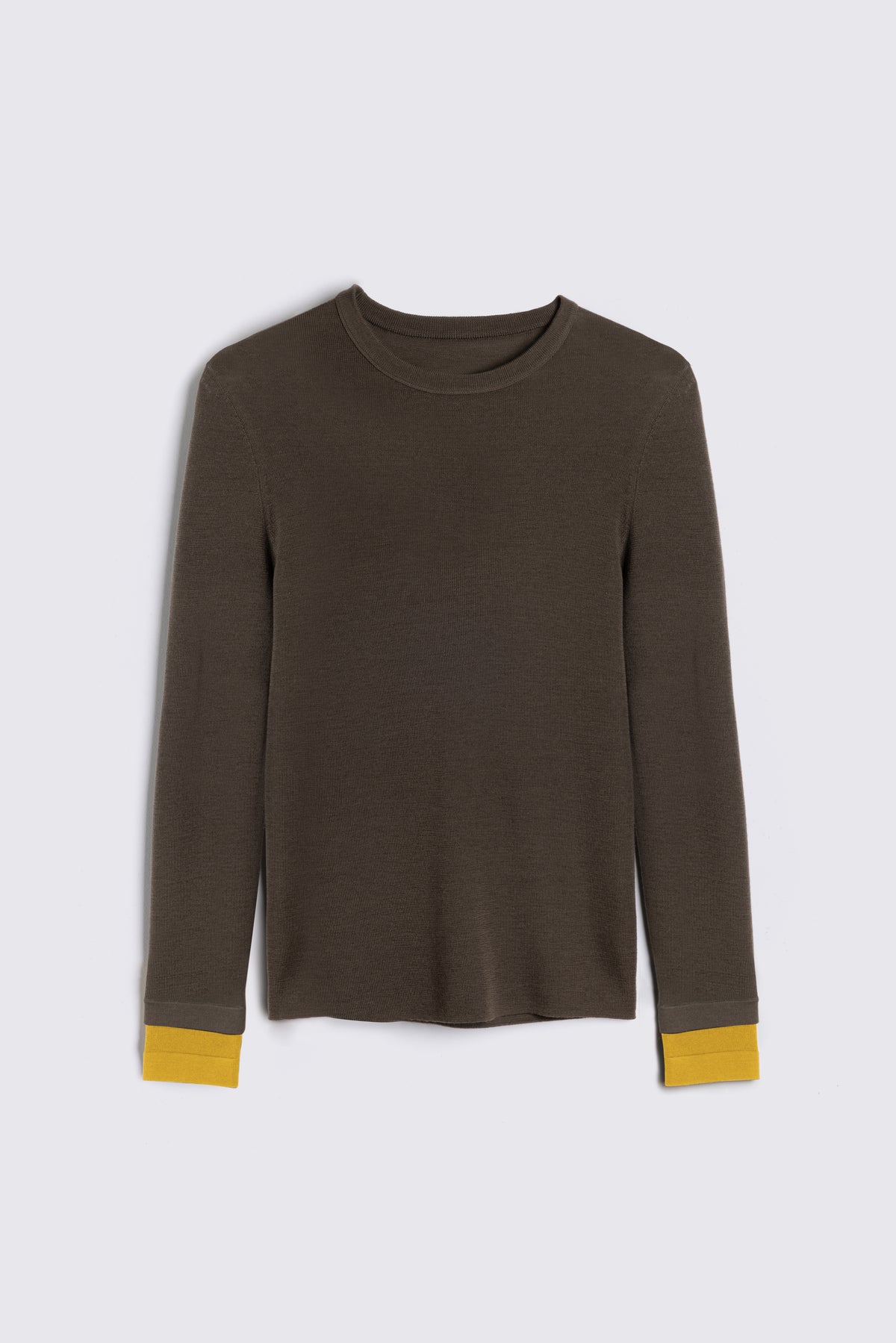 Olive jumper, the Trinny fine merino crewneck in dark olive with a mustard contrast cuff
